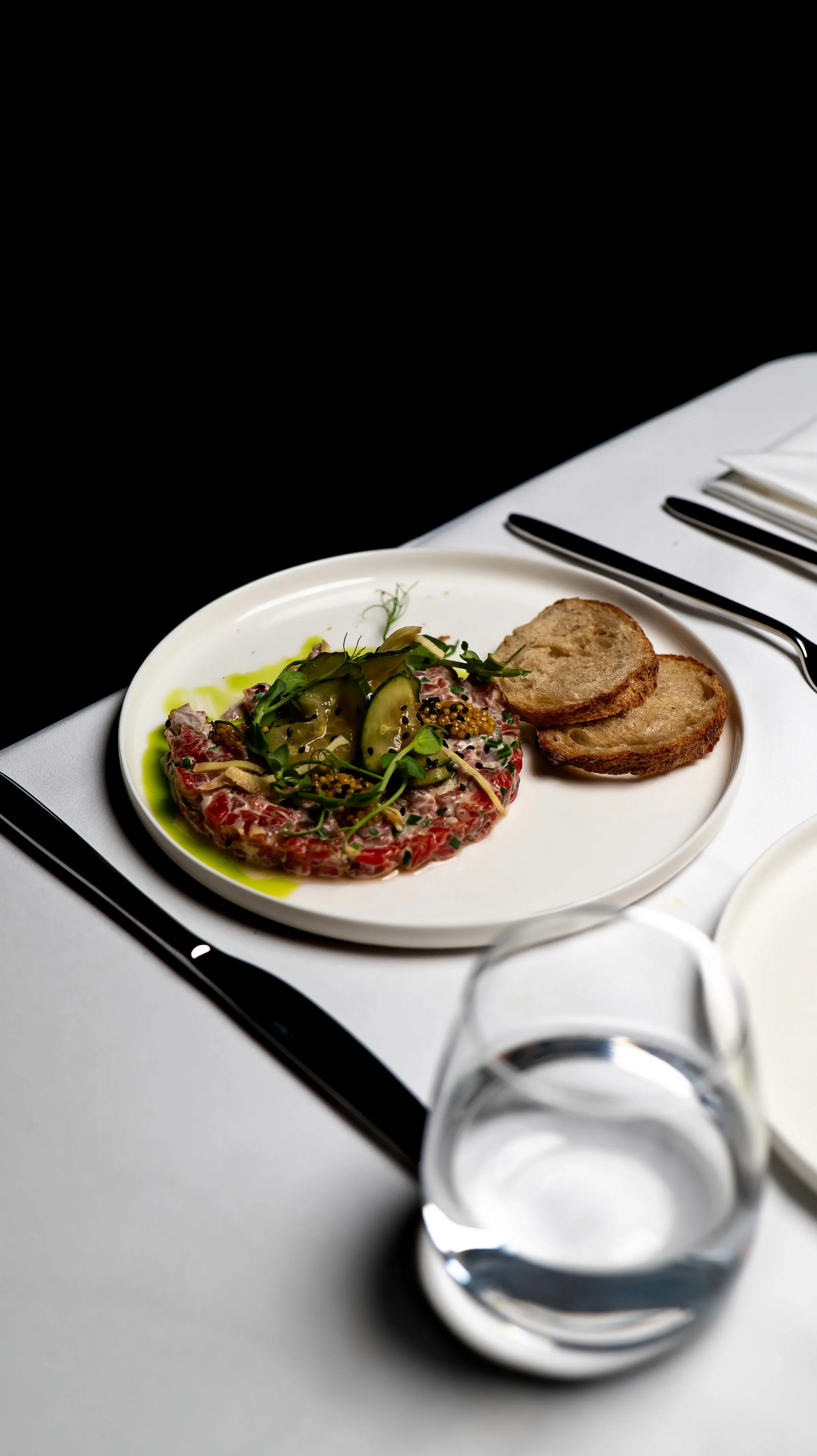 two people looking at a tablet and smiling