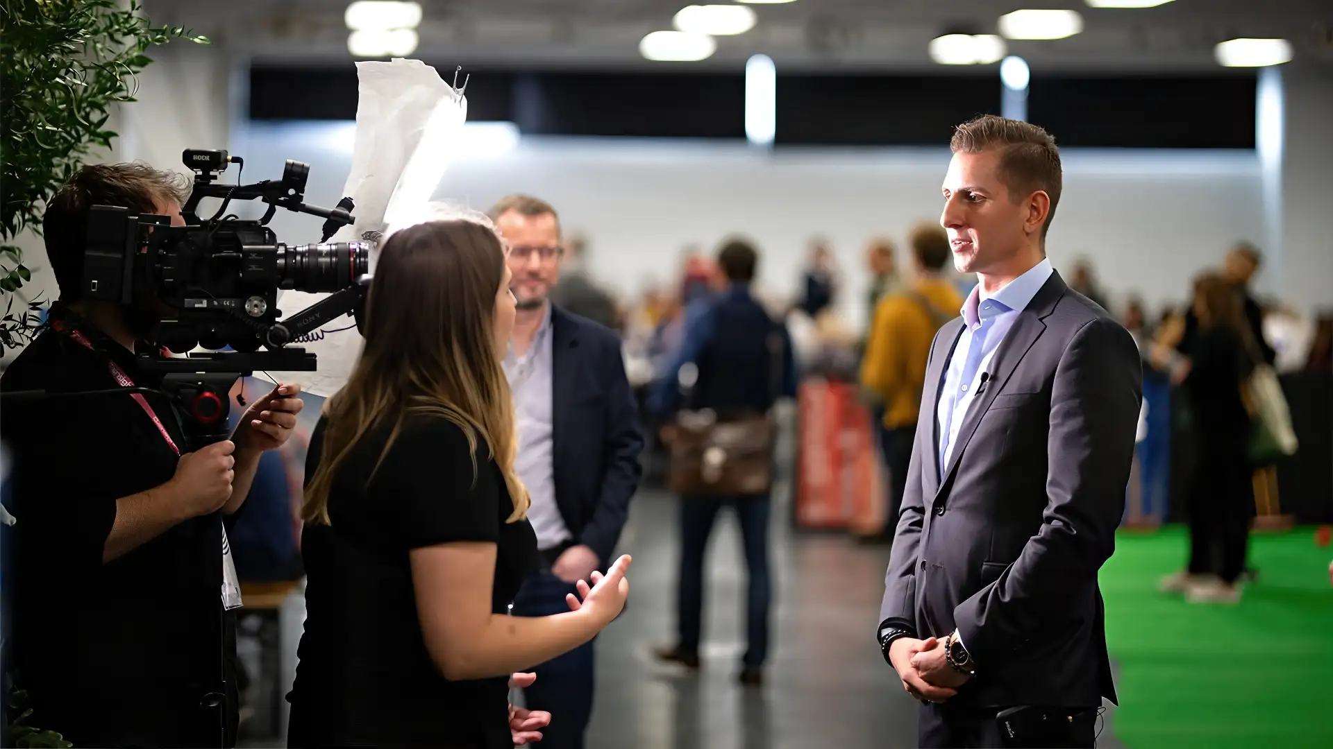 On-site video crew filming an interview with a conference speaker during Gainsight Pulse