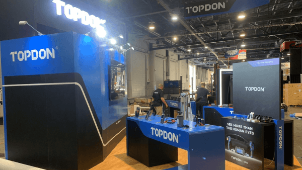 A SEMA project organized to balance vehicle-focused branding, open circulation, and cleaner show-floor visibility across the booth footprint.