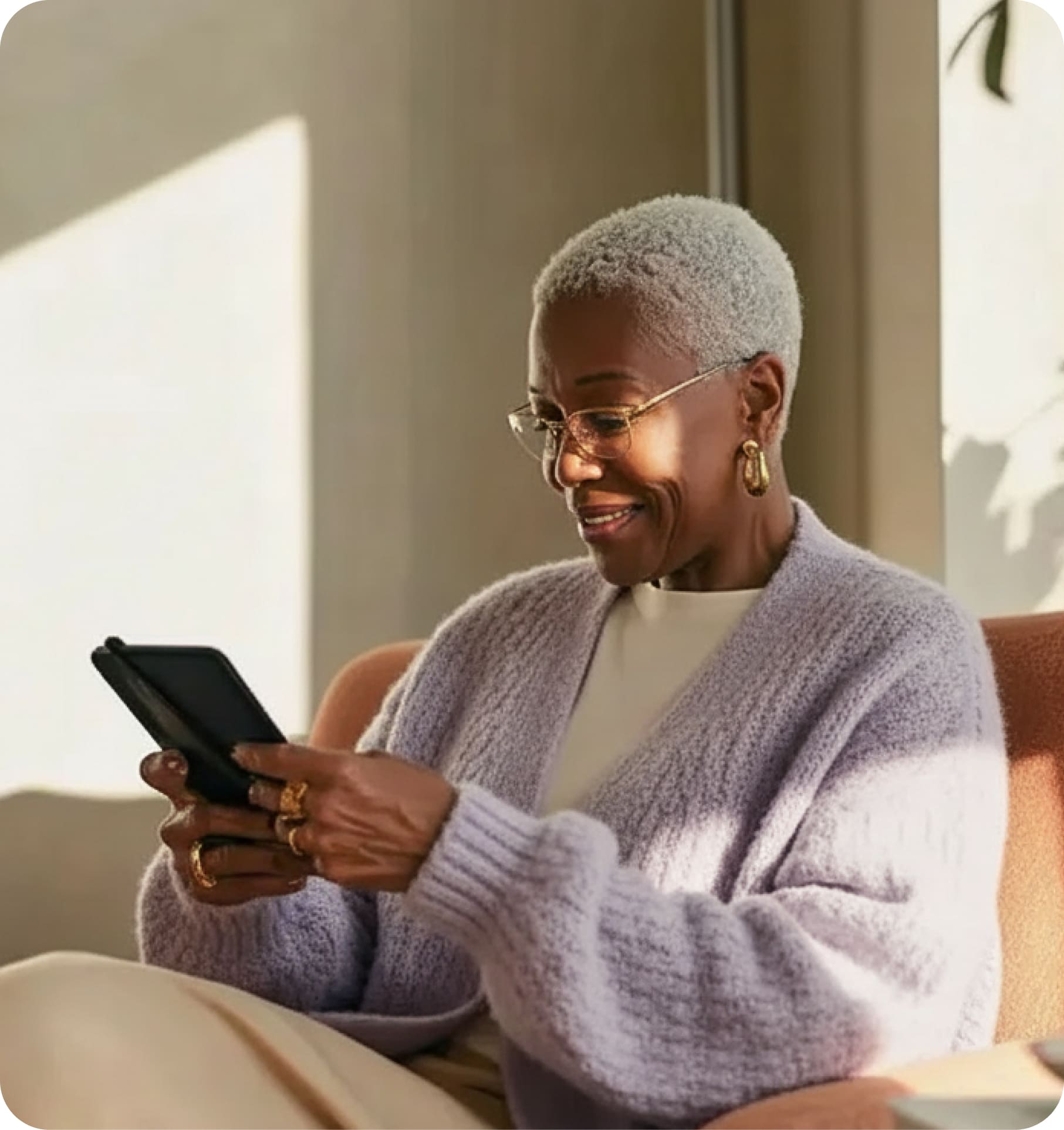 An elderly patient using a tablet device.