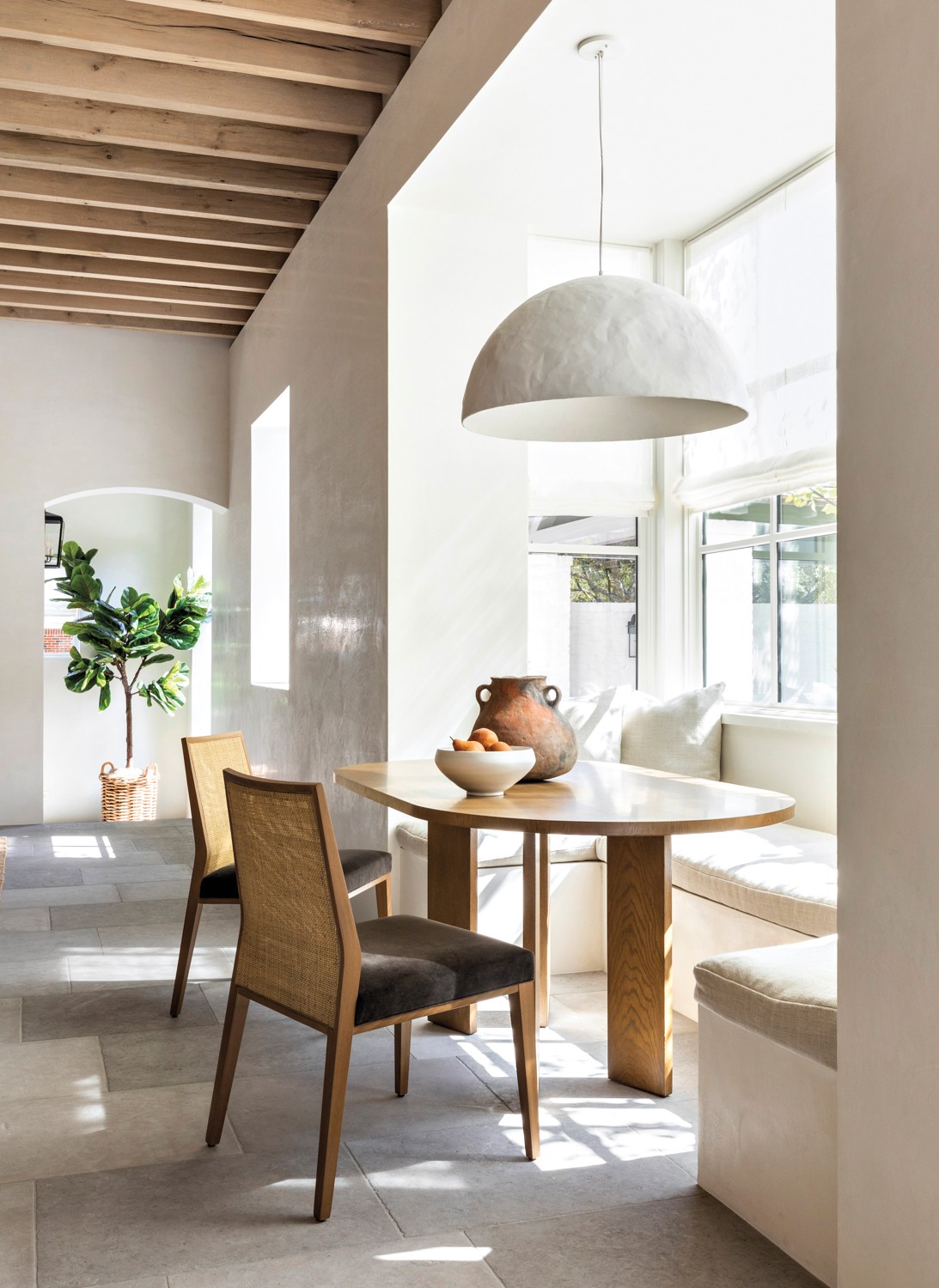 Modern neutral living room with comfy chairs and venetian finish