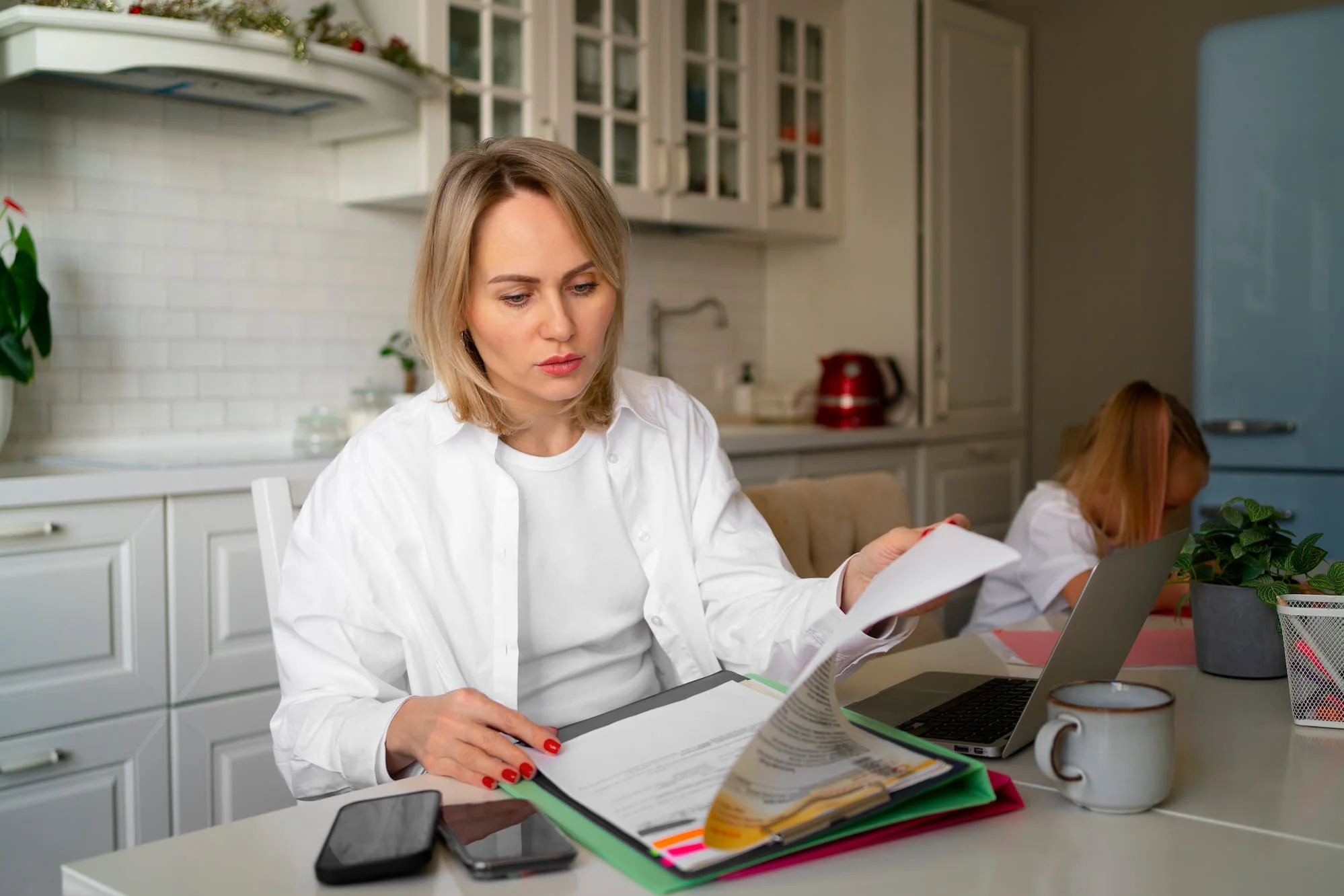 Woman looking at her house sale property forms for conveyancing