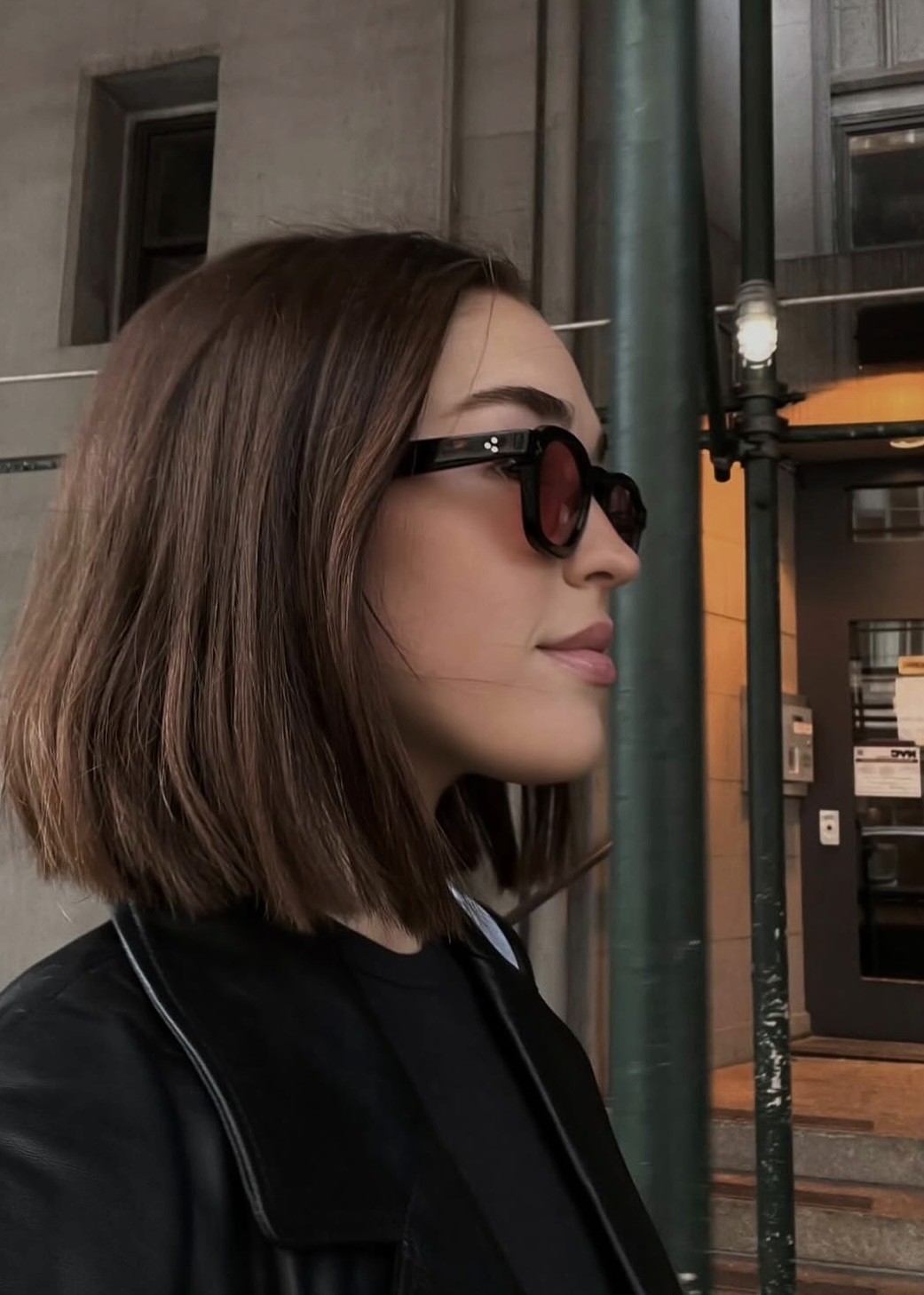 Sleek chin-length brunette bob haircut with face-framing layers, downtown haircut salon, Manhattan hair salon