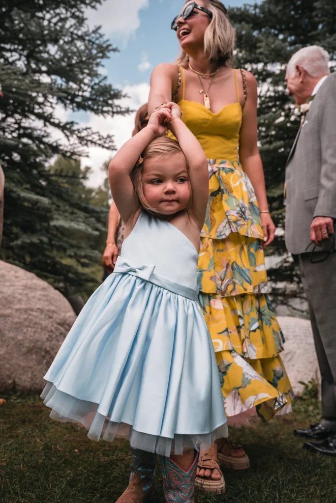 Flower girl walking down aisle at Bosq Aspen wedding
