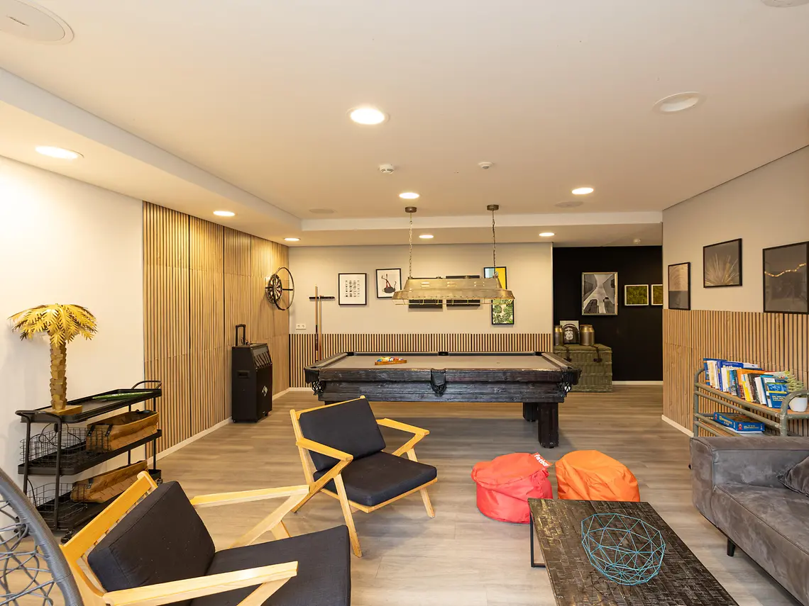 Communal lounge in student accommodation in Frankfurt with seating and social space