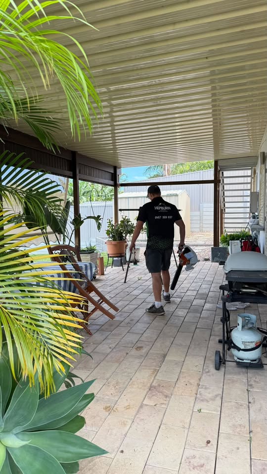 Hepburn Property Maintenance team member completing general property maintenance outdoor area clean up Gold Coast