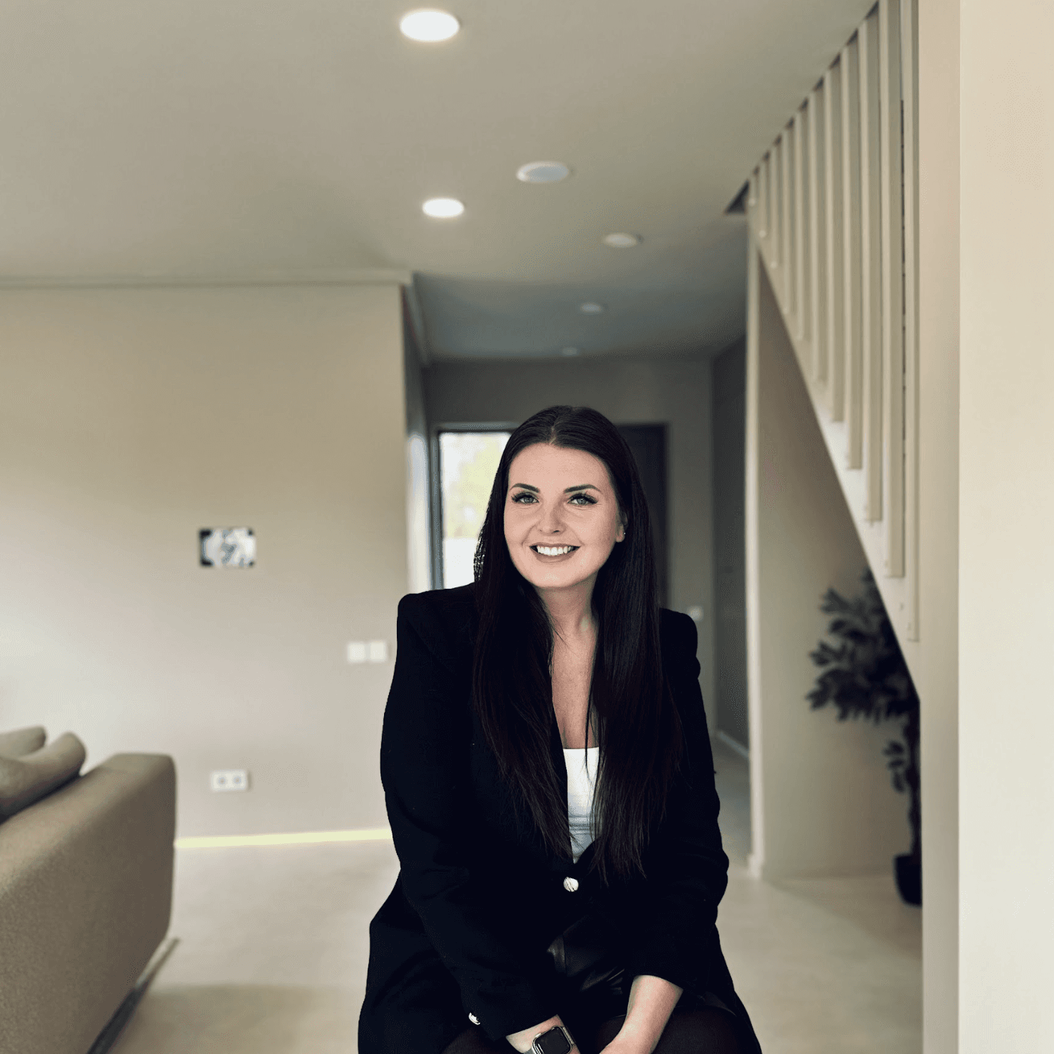 Portrait of Elina Udre, Project Developer at Grande Build, photographed inside a modern energy-efficient home in Priežavoti Village.