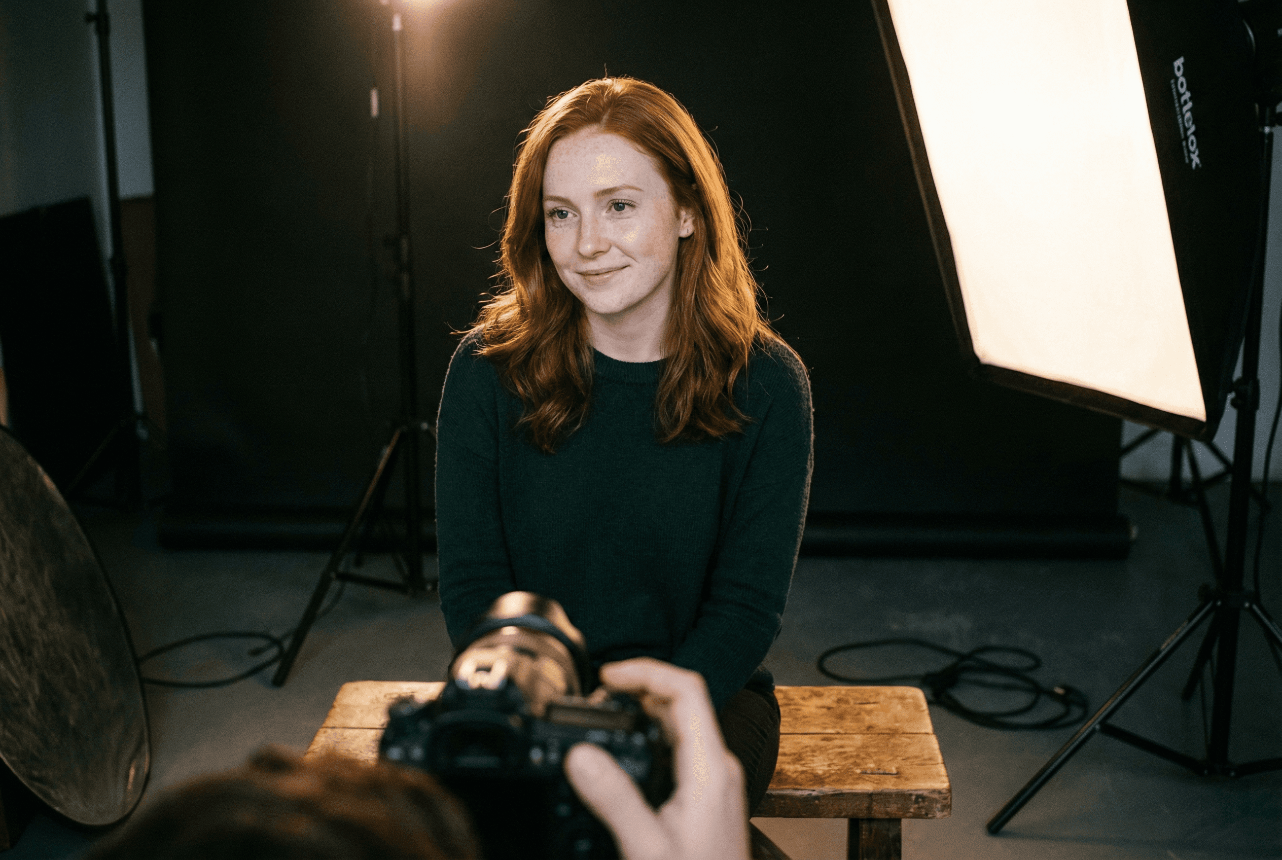 A man stading with Surfboard