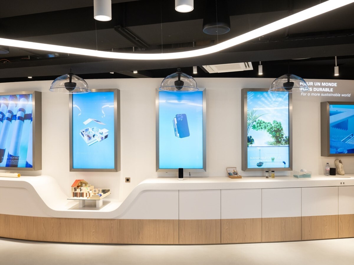 Photos of 5 touchscreens with interactive experiences for visitors to use.
