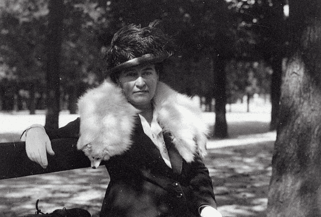 man in brown button up long sleeve shirt holding black smartphone