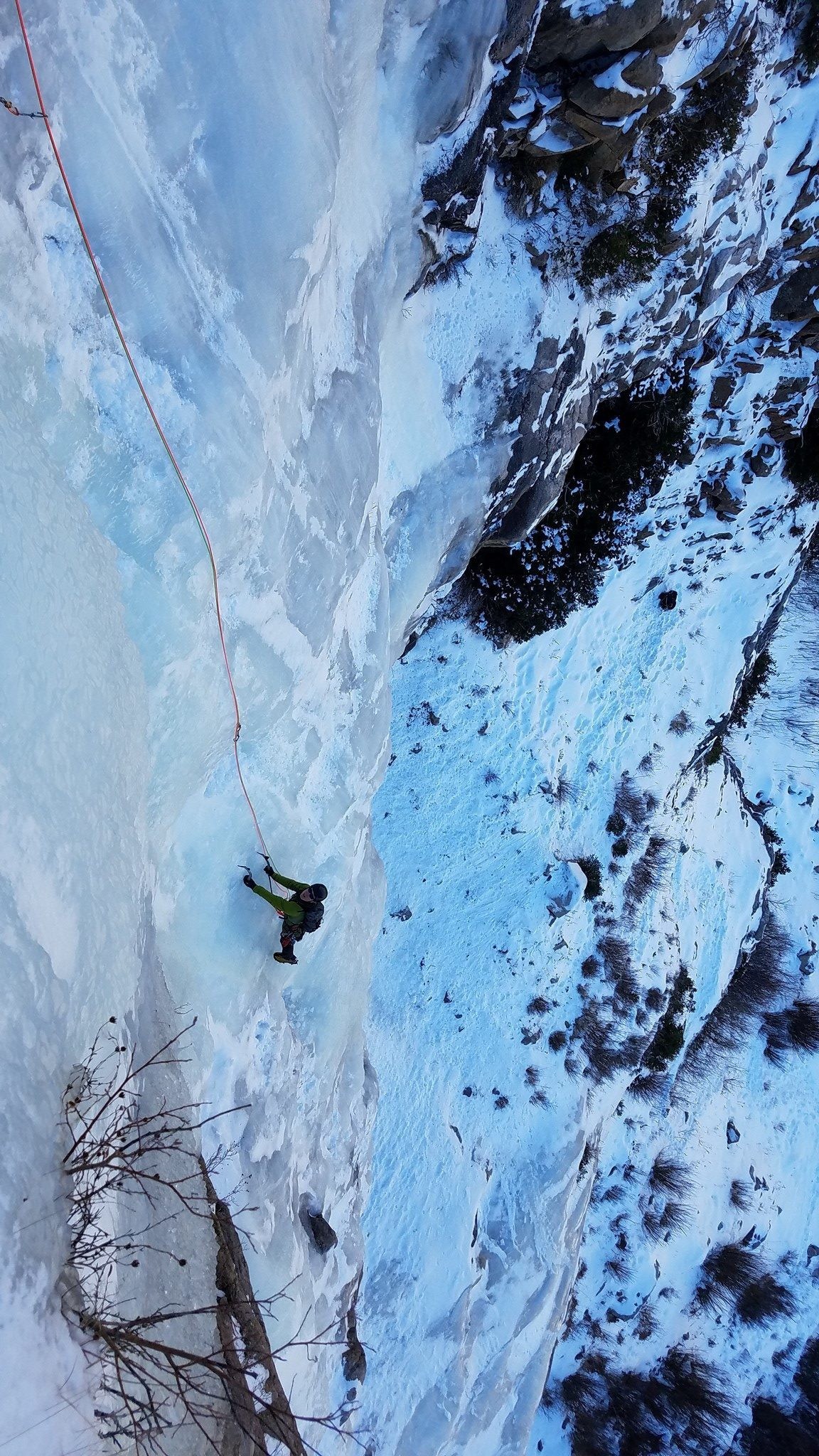 Ice climber looks up in a sea of ice
