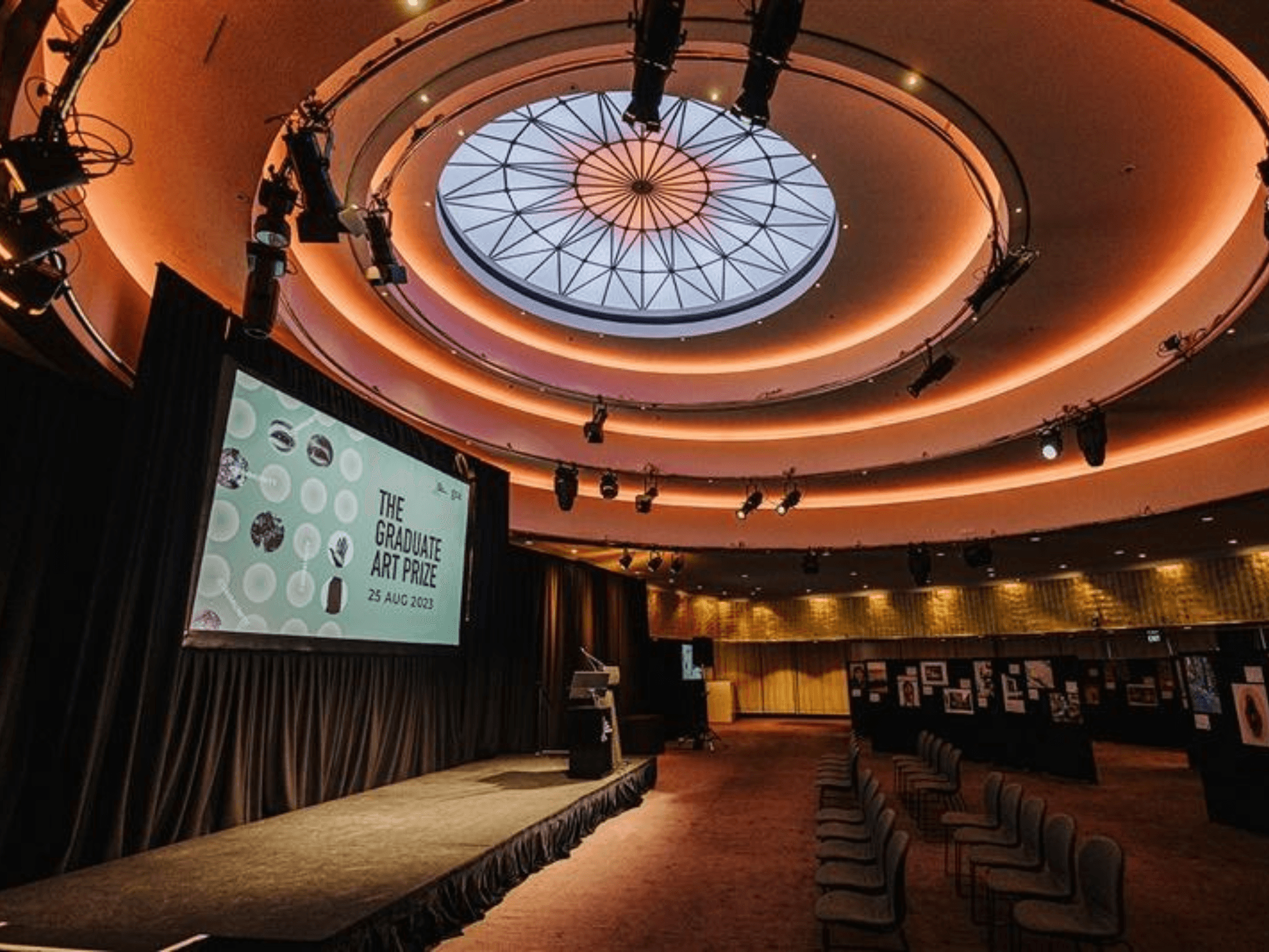 Blonde woman in red turtleneck looking over shoulder