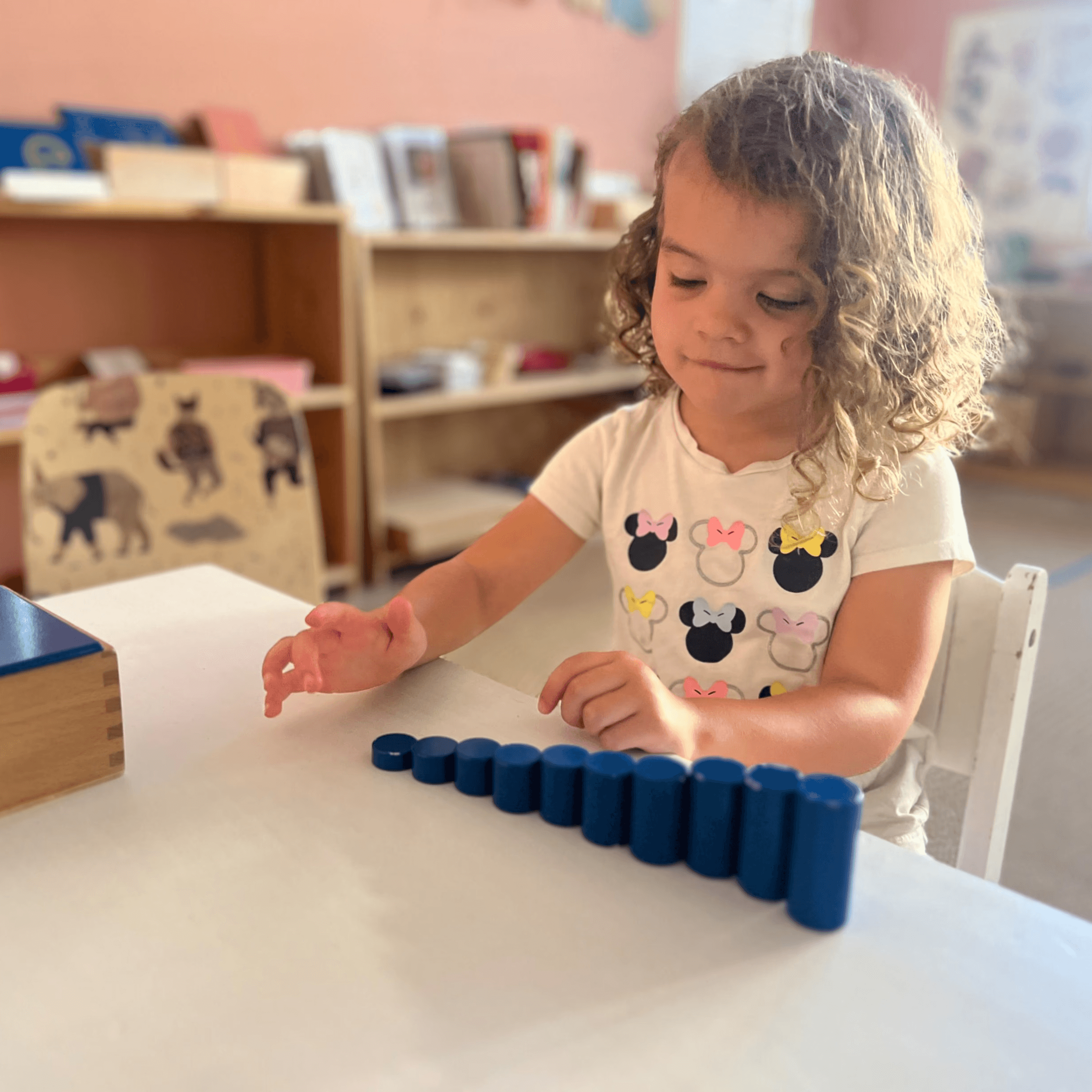 Child engaged in independent Montessori work at an in-home Montessori school in Irvine, California