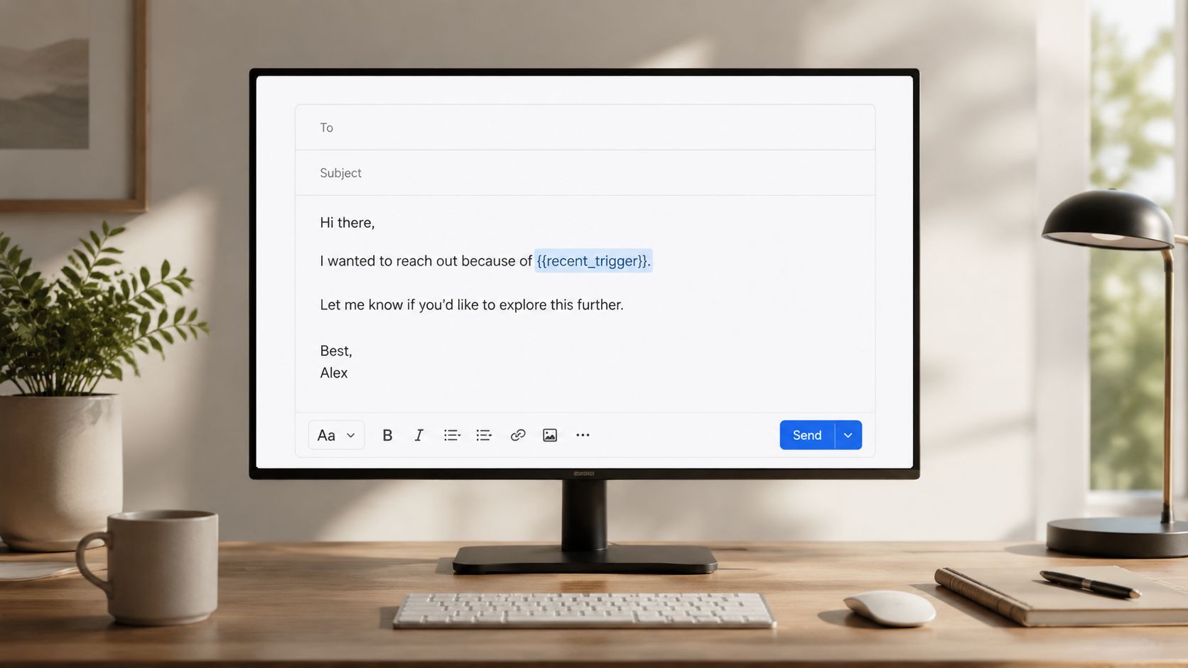 A computer monitor displaying a customizable sales email template on a wooden desk in a home office.