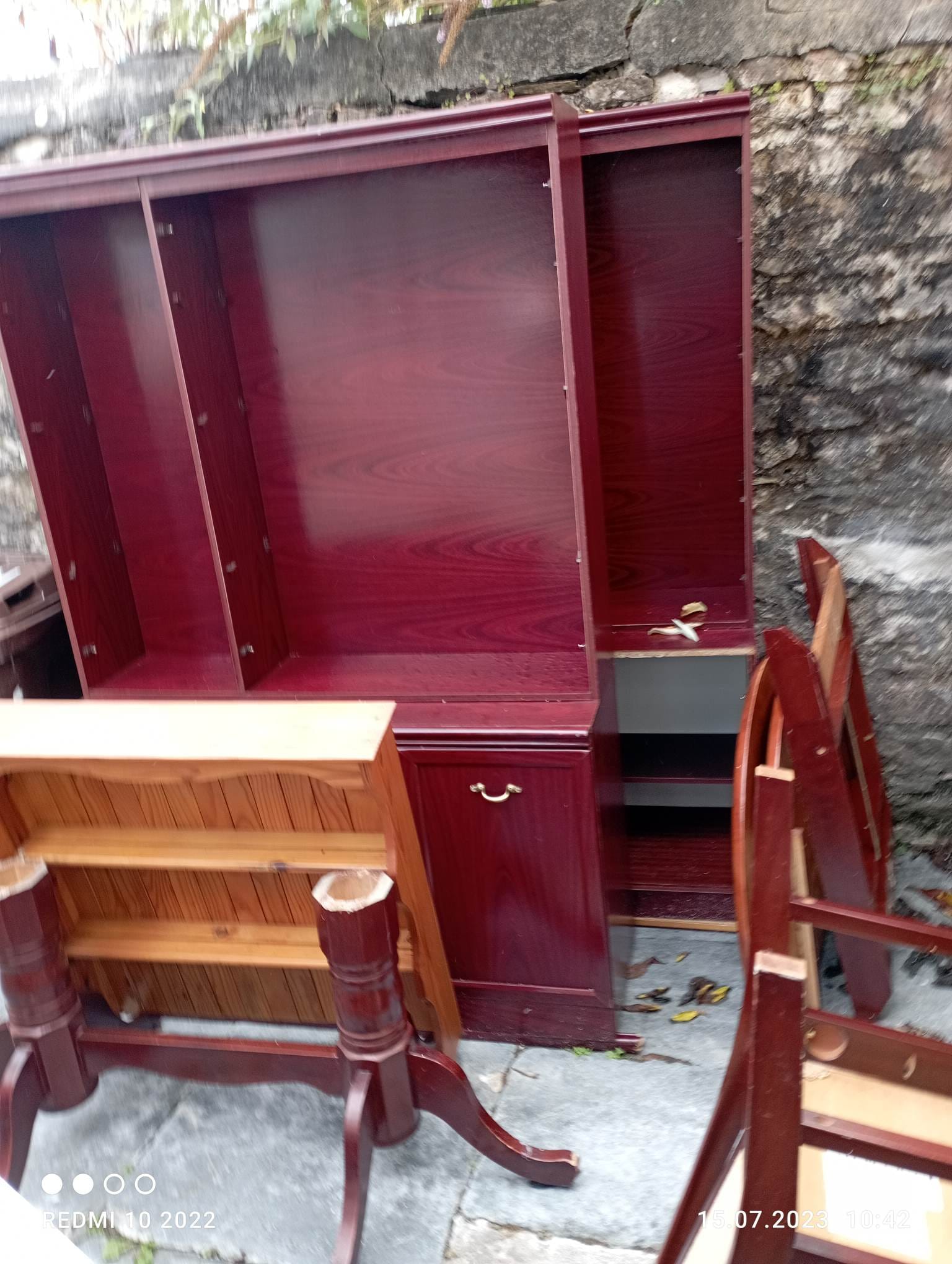 Various household items, including a wooden desk and chairs, organized for responsible waste removal and ethical disposal.