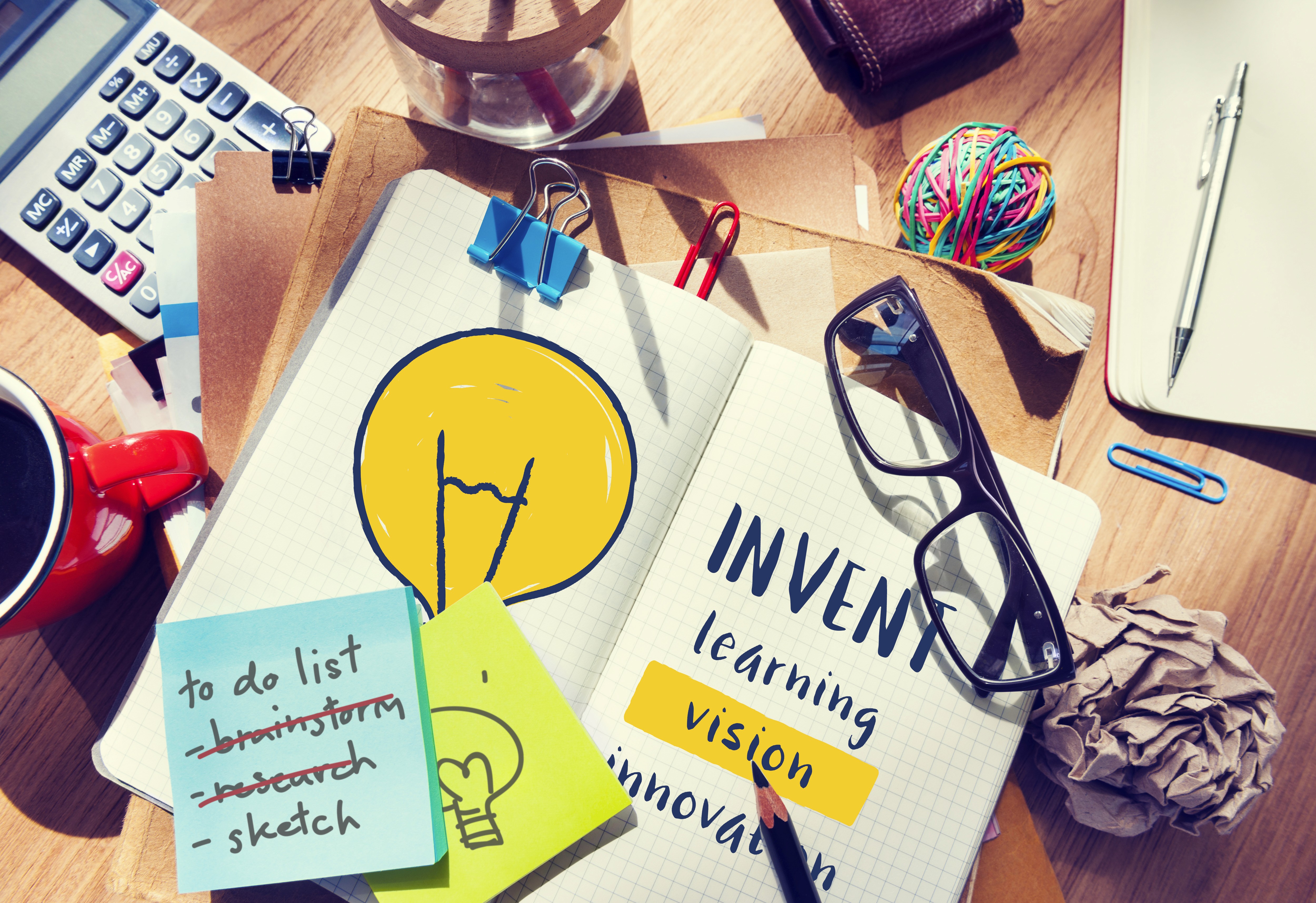 blue and yellow curtain wall building during daytime