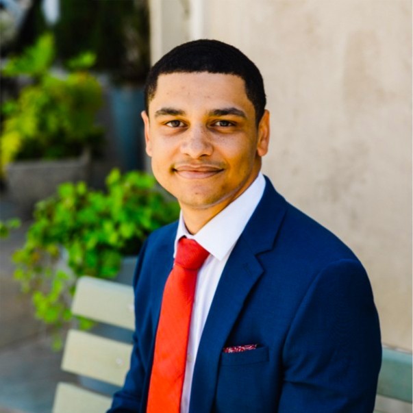 A smiling man in a suit