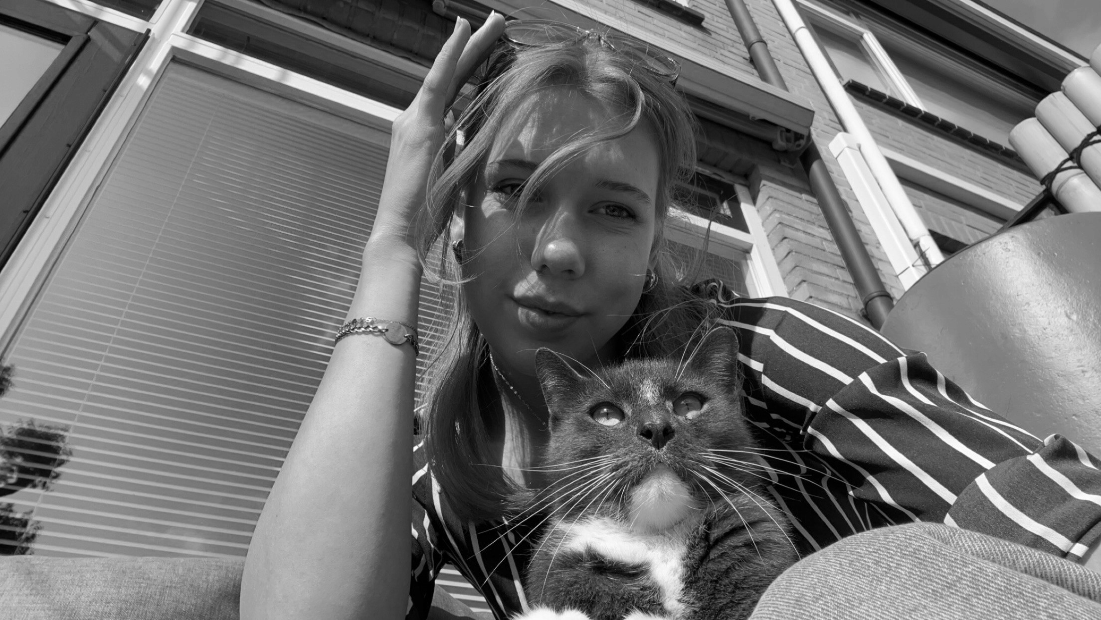 A selfie of a woman with a cat