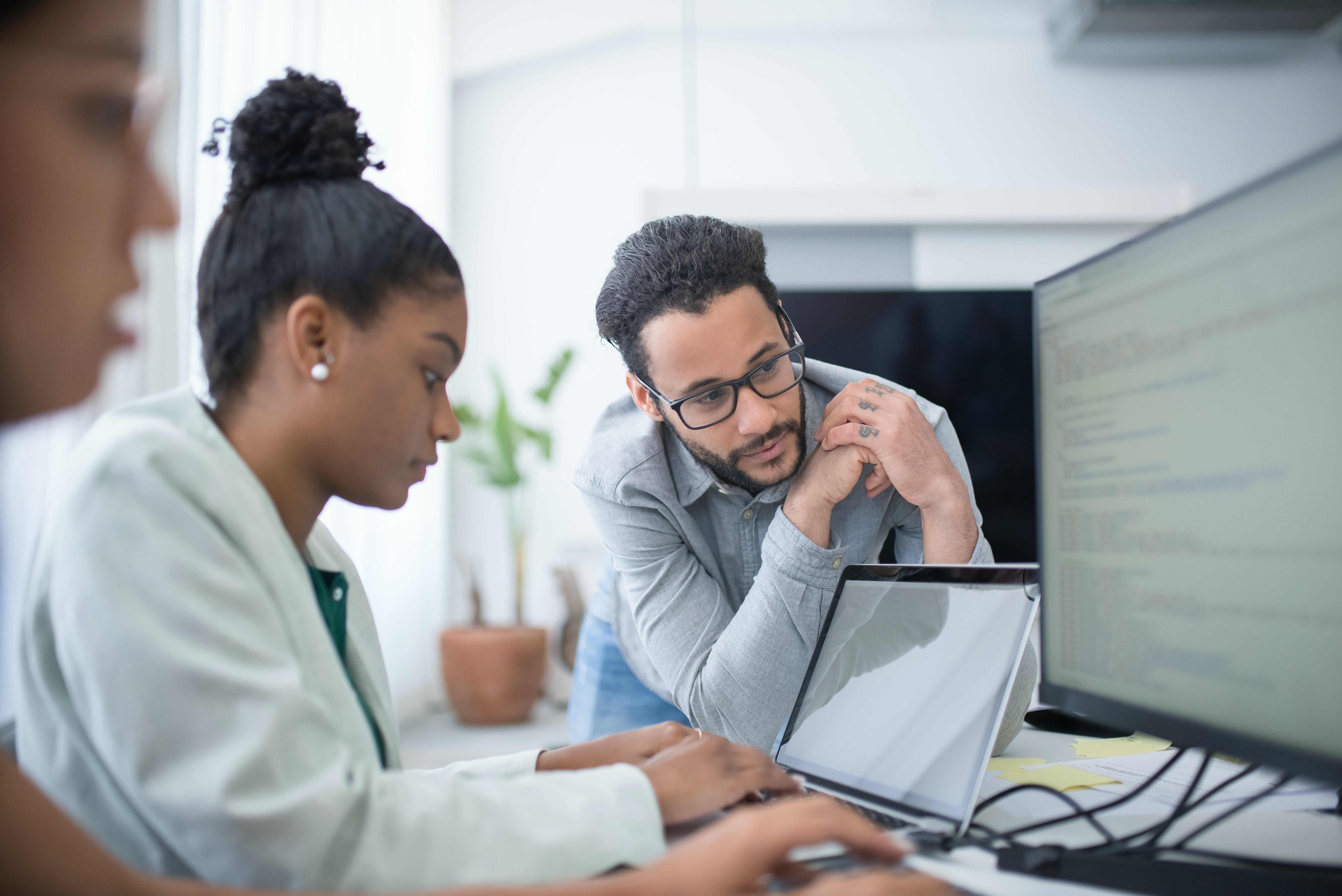 Business people reviving their cold email list using tools on their laptop and computer