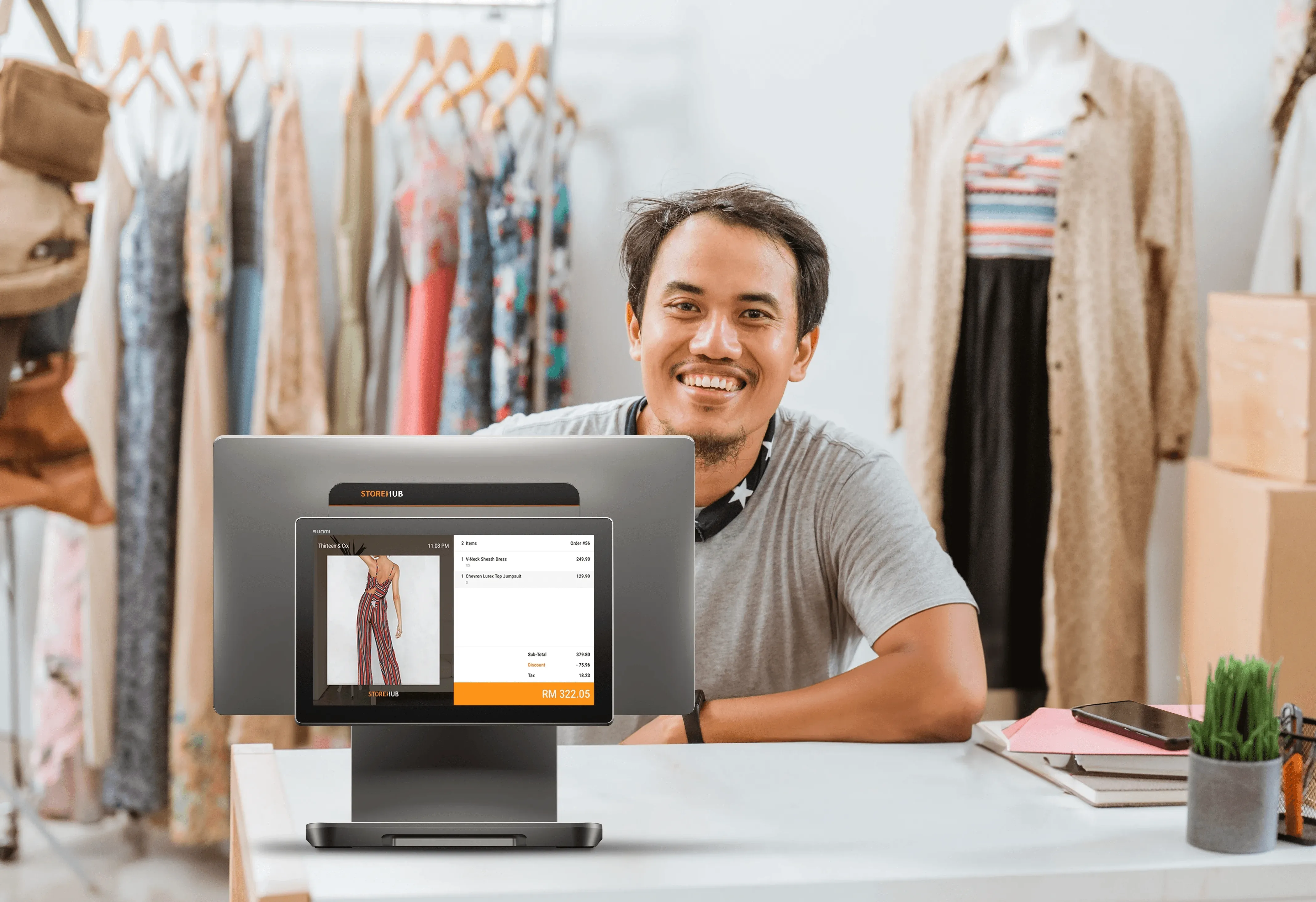 Malaysian retail business owner using the StoreHub cloud POS system for inventory management and sales reporting.