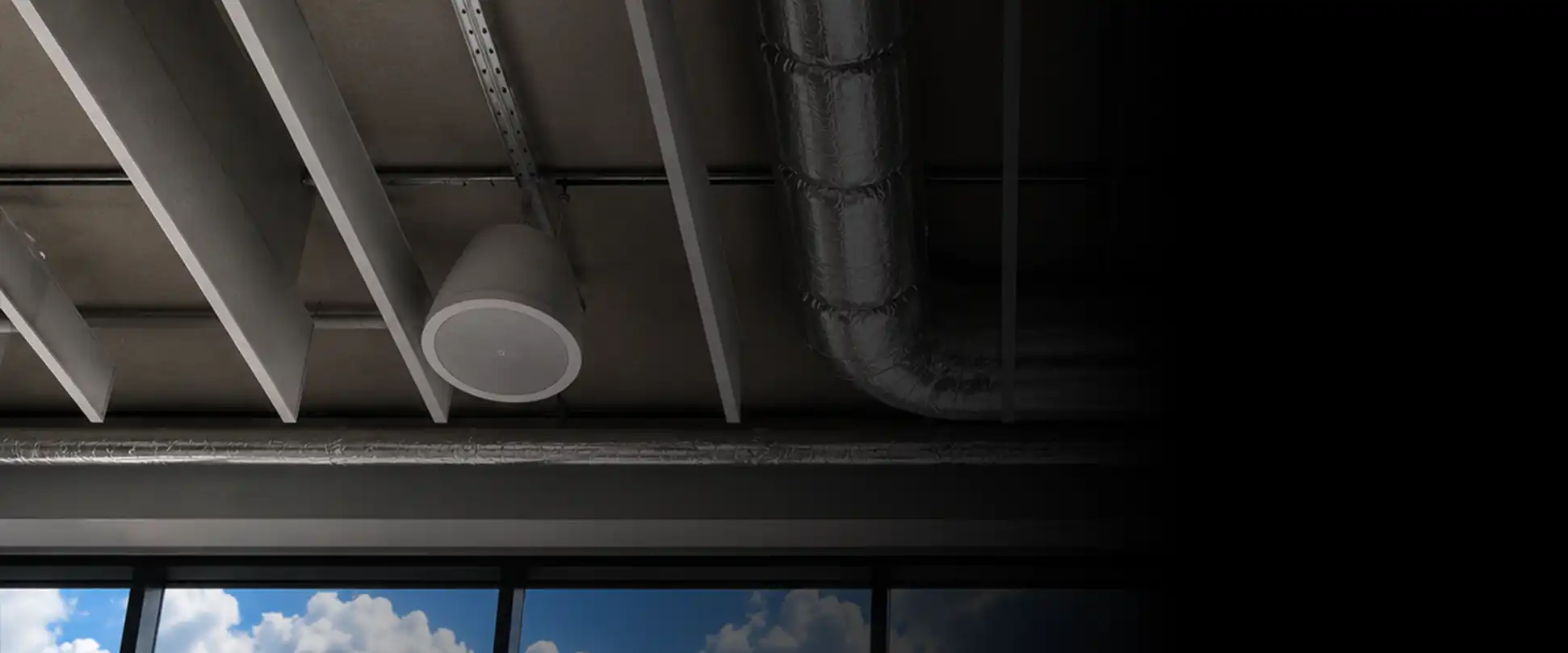 Commercial presentation display with wall-mounted audio speaker