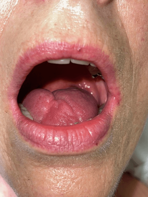 smiling happily caregiver hugging her old