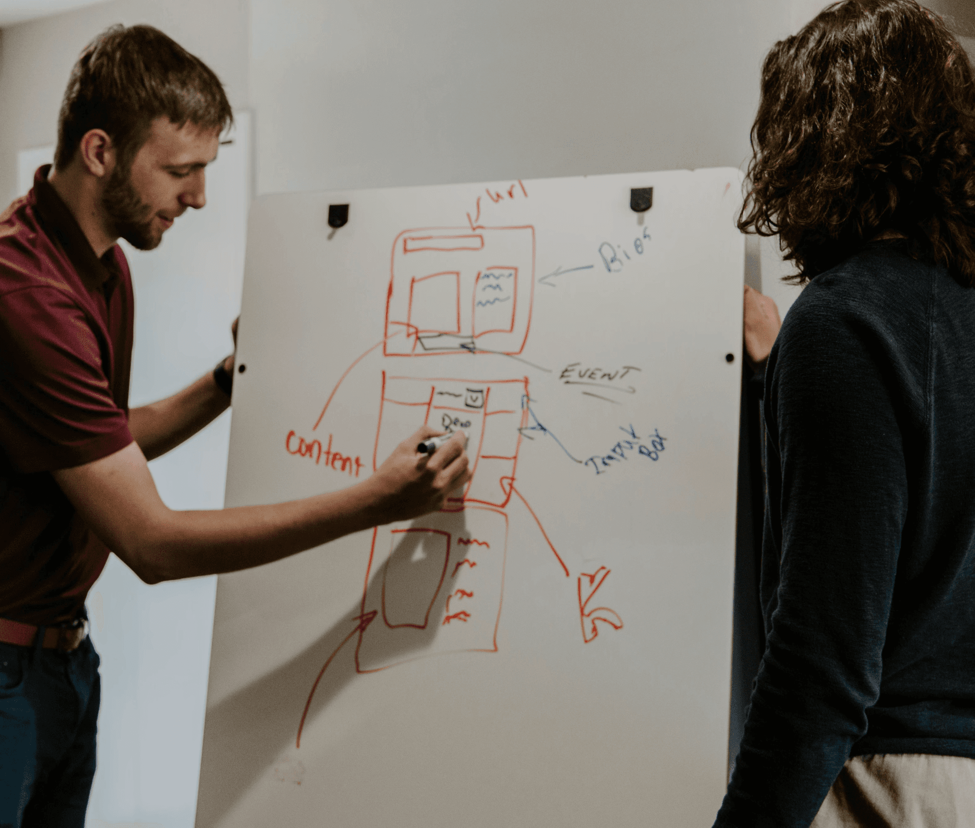 person sitting in a chair in front of a man