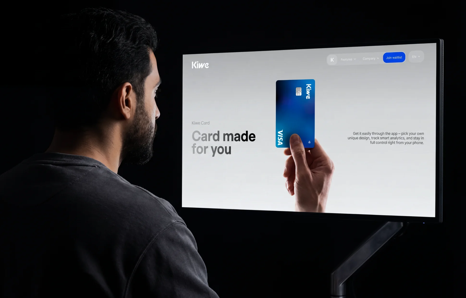 Person viewing Kiwe Bank marketing website on desktop — "Card made for you" section with Visa card visual