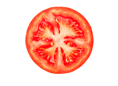 Close-up of a fresh, sliced tomato, displaying vibrant red flesh and a star-like pattern in the center.