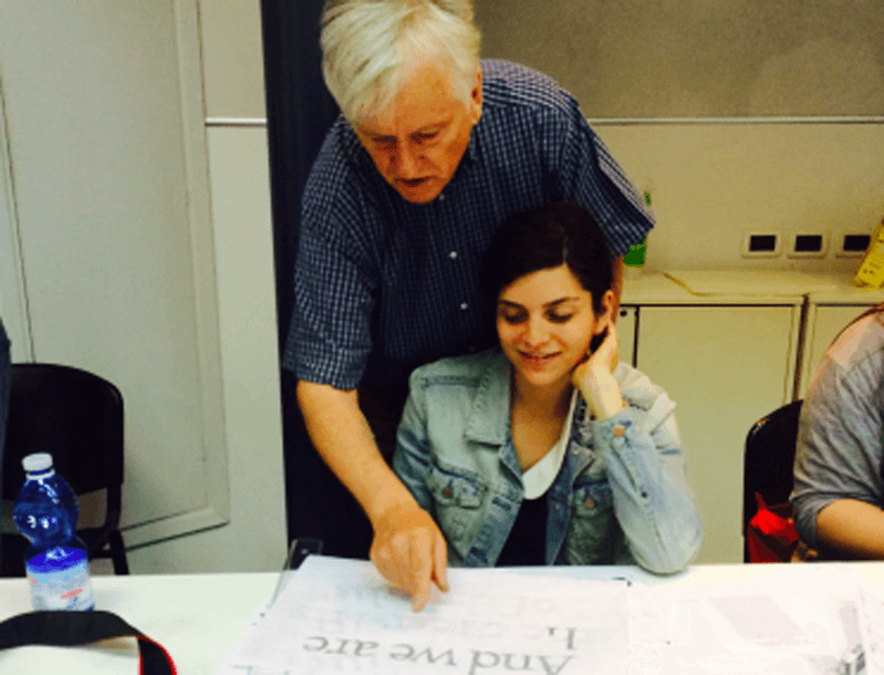 Teacher critiquing student's work
