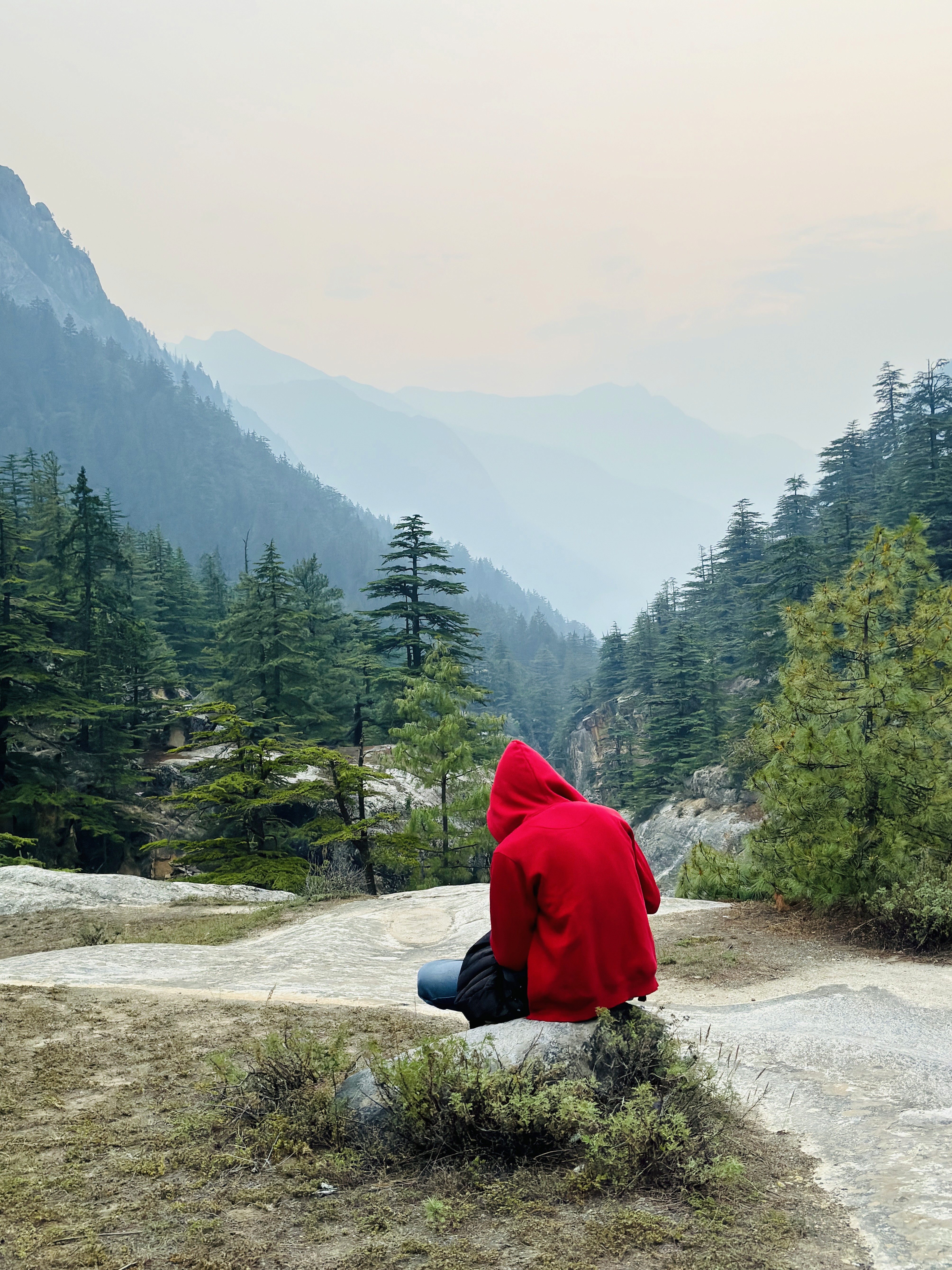 a group of people standing on top of a sandy beach