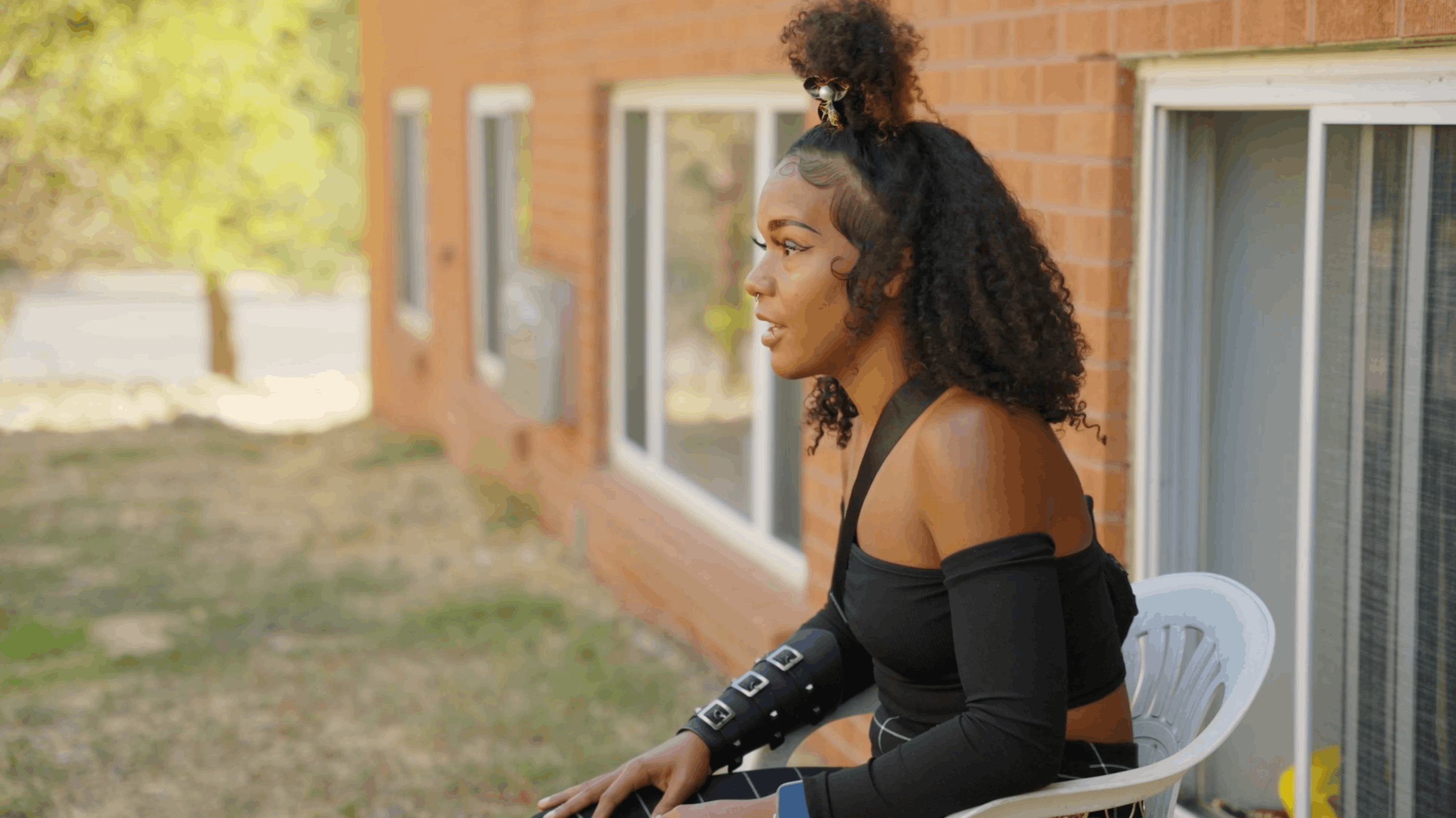 woman speaking during an outdoor interview at ananeo recovery housing