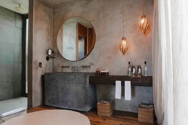 Fuego Suite at Nômade Tulum featuring private pool, seating area with chairs and table, and hanging lamps.