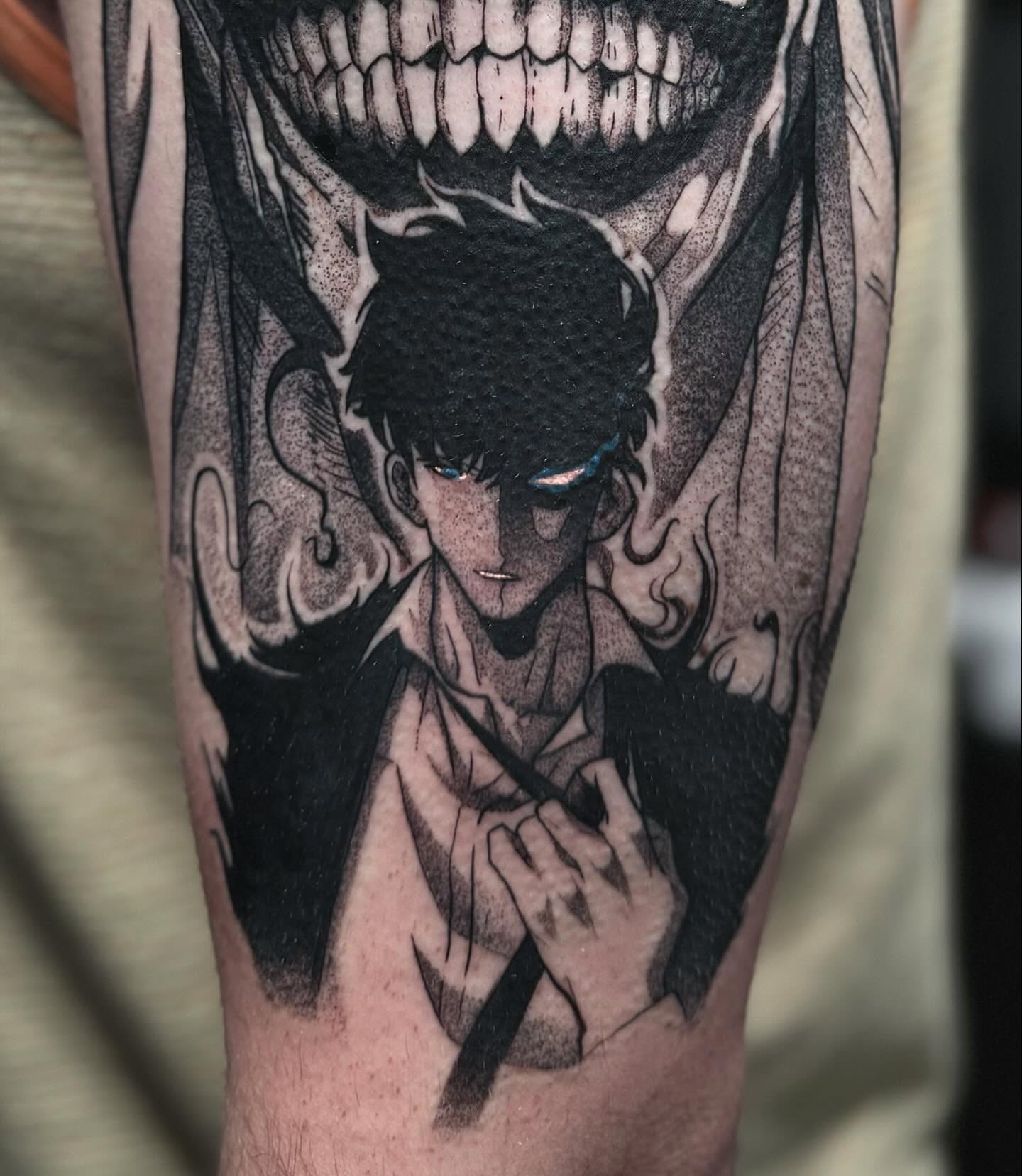 A forearm tattoo of Nezuko Kamado from Demon Slayer, depicted in a stylized anime art style. She is holding a sword.