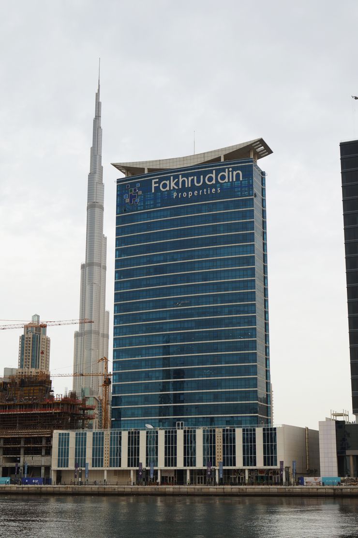 Lake Central Tower standing tall next to the Burj Khalifa, showcasing prime real estate in Dubai.