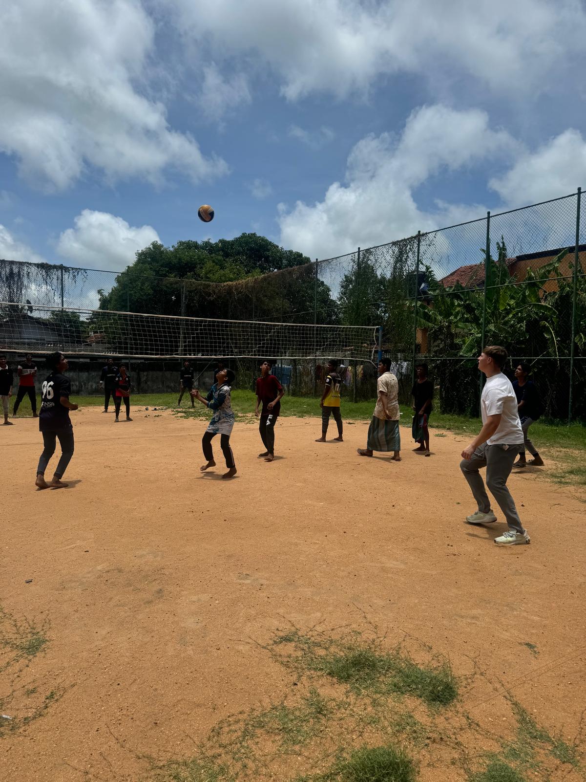 two people looking at a tablet and smiling