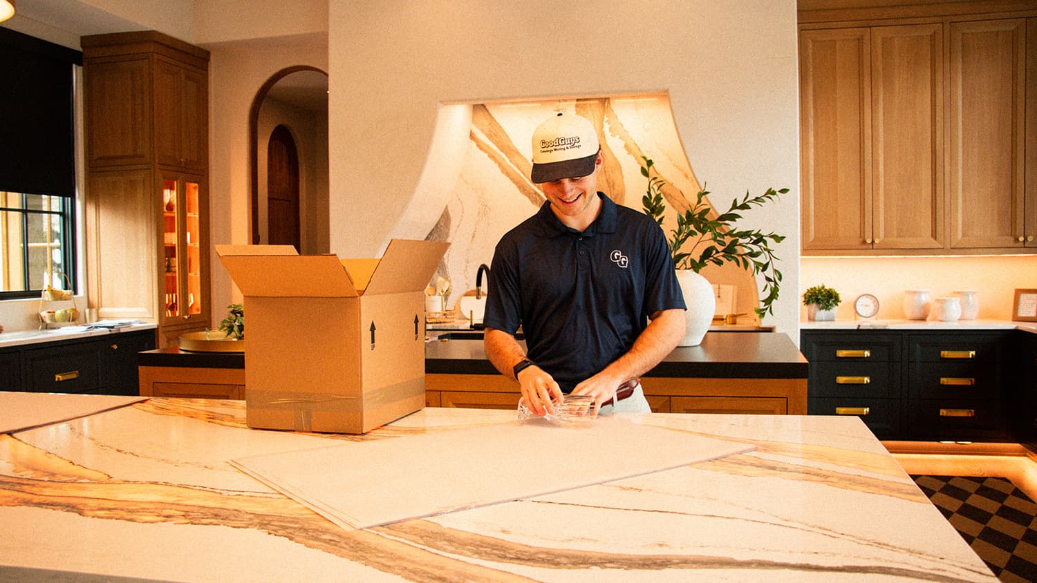 Mover packing a kitchen