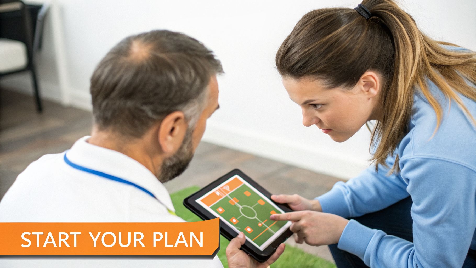 A man and woman intensely discuss a sports strategy displayed on a digital tablet.