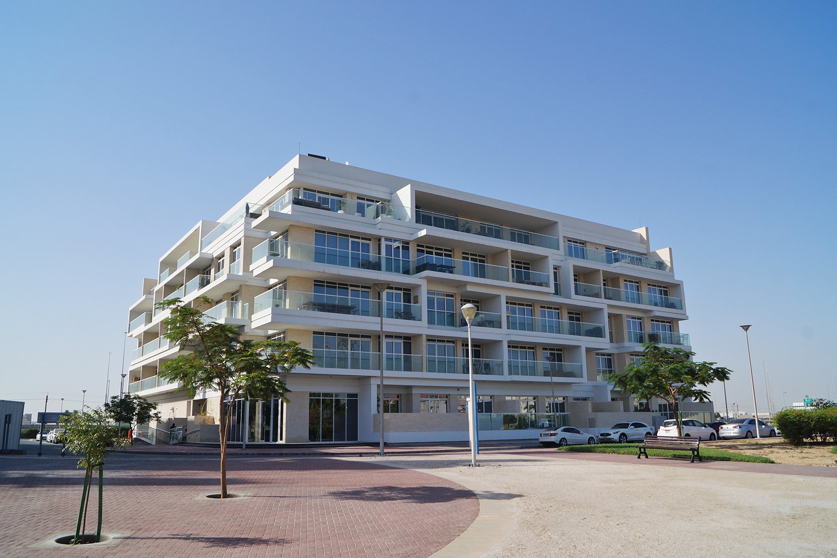A large white building with balconies located in District 1.