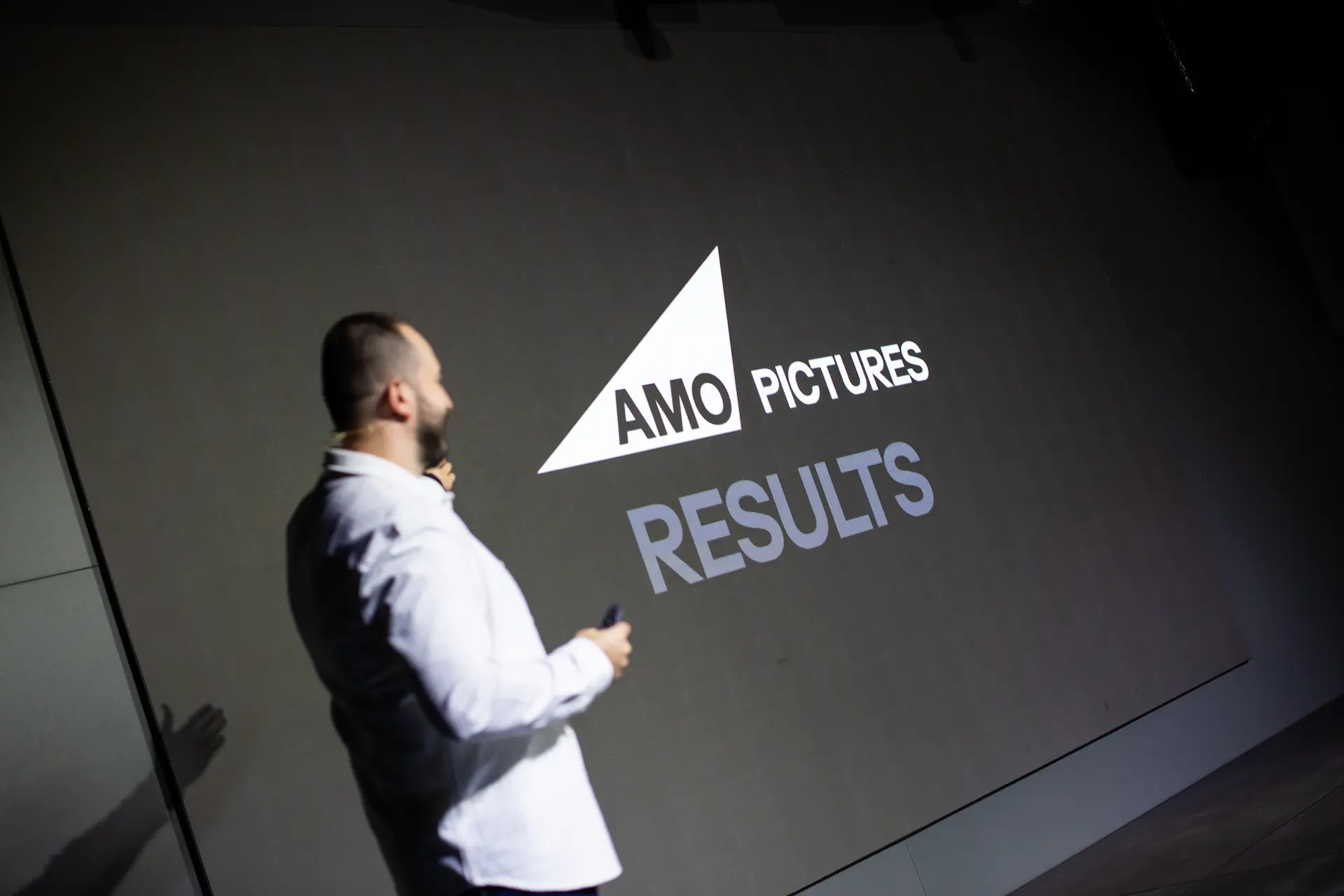CEO of Amo Pictures on stage during presentation