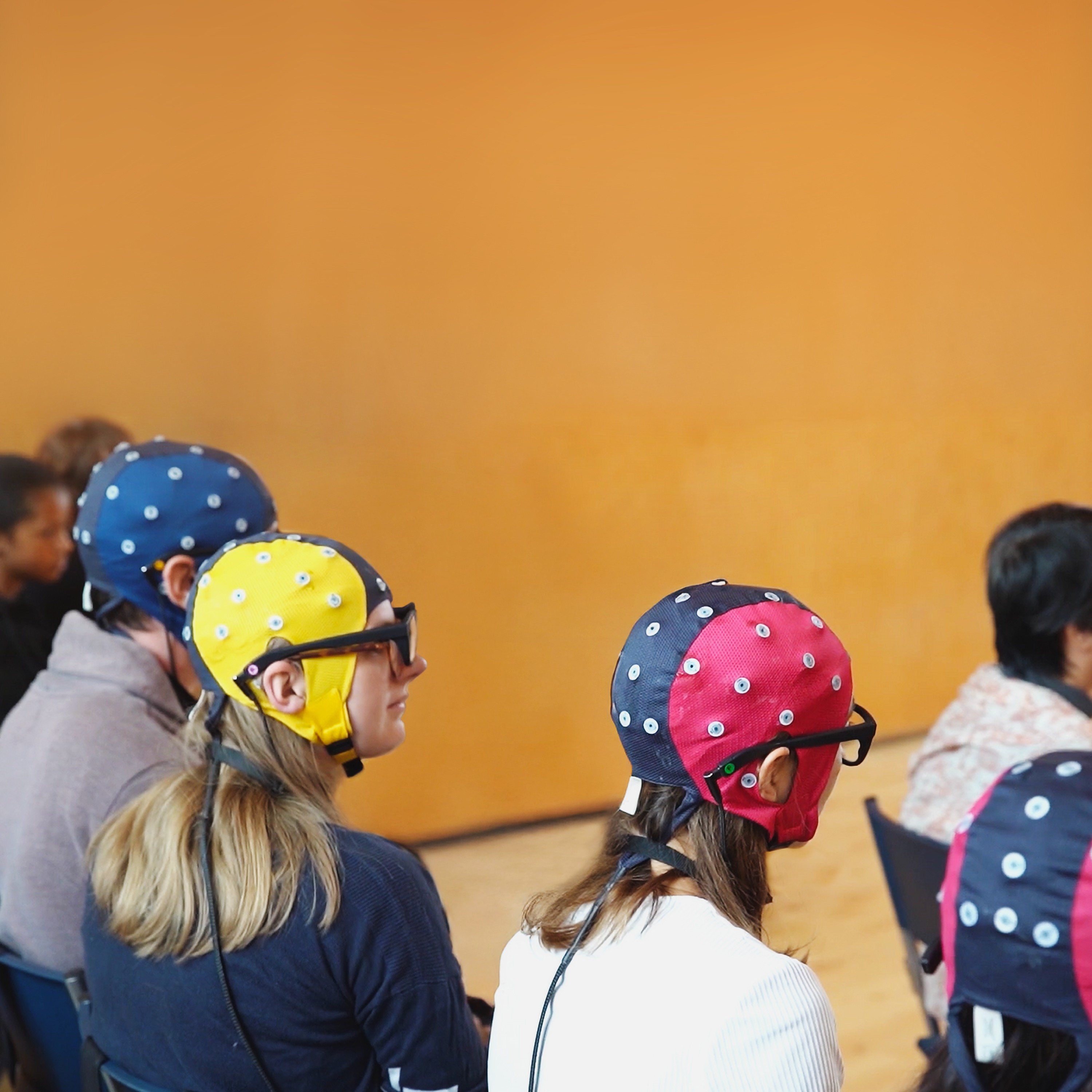 Neurolive: Audience members of a live performance wearing Pupil Labs eye trackers with ANT neuro EEG systems.