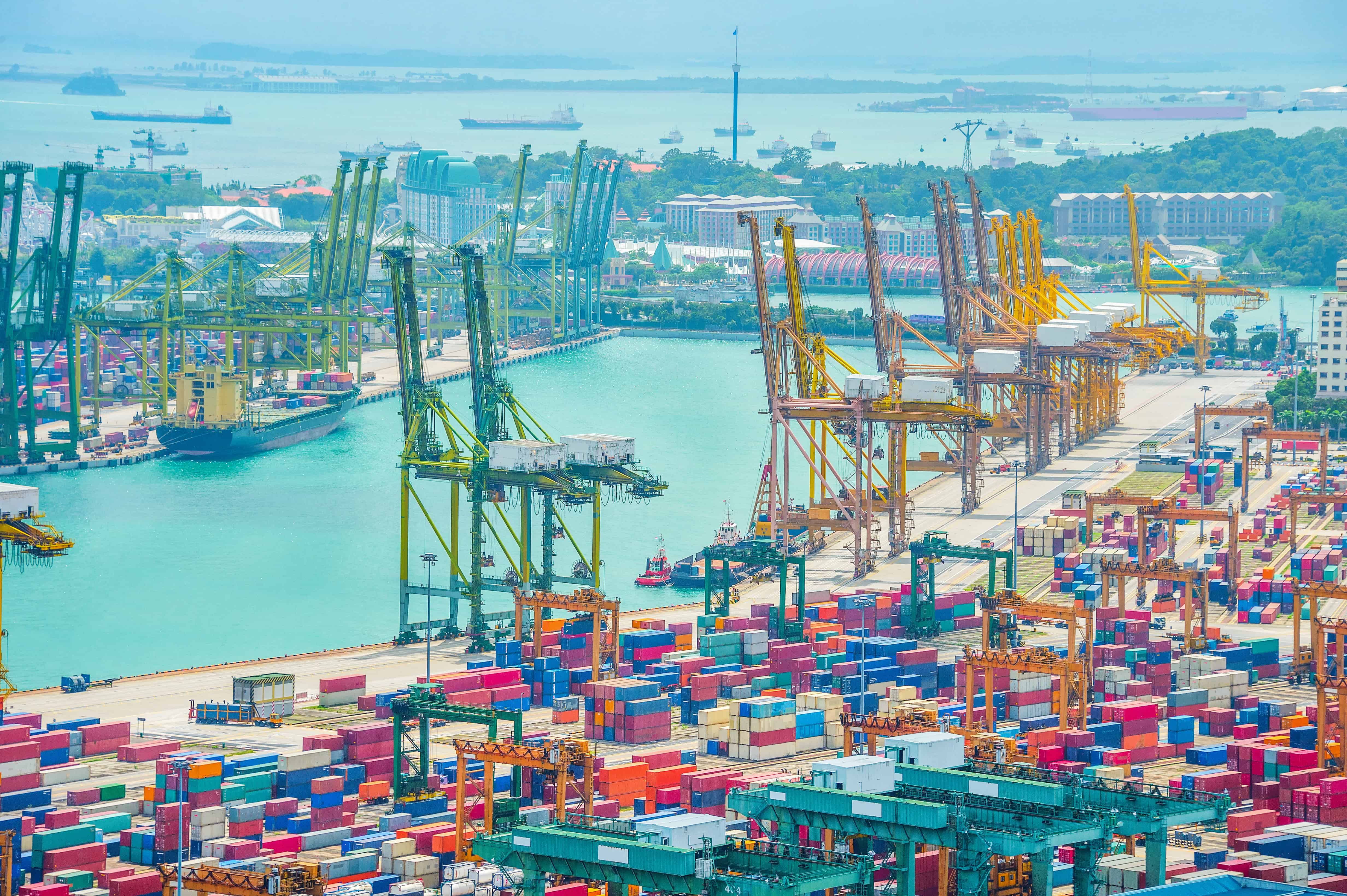 Singapore container port with cranes, representing maritime and high-risk industries affected by psychosocial risk