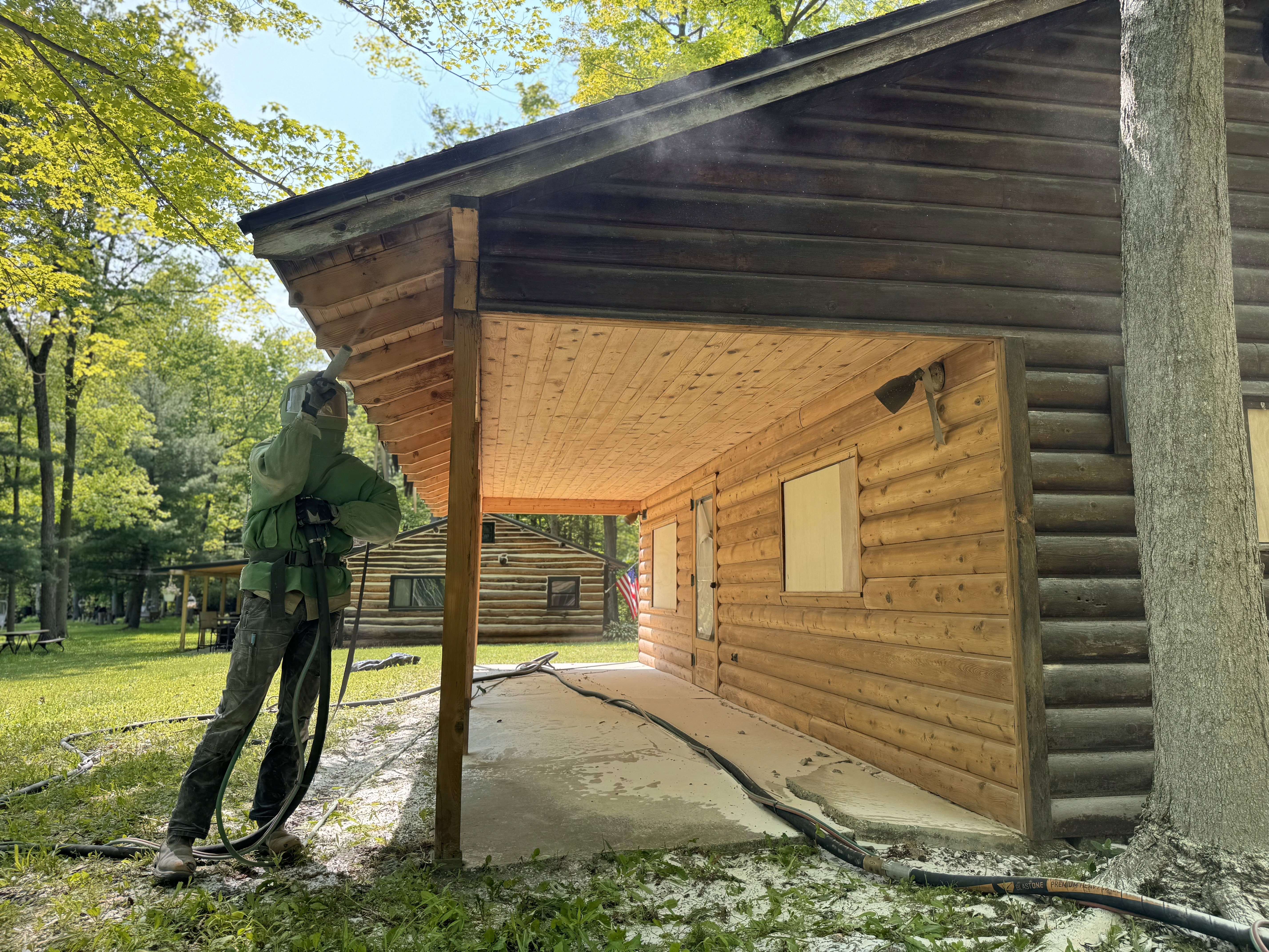 Log cabin sandblasting by Rochester Sandblasting