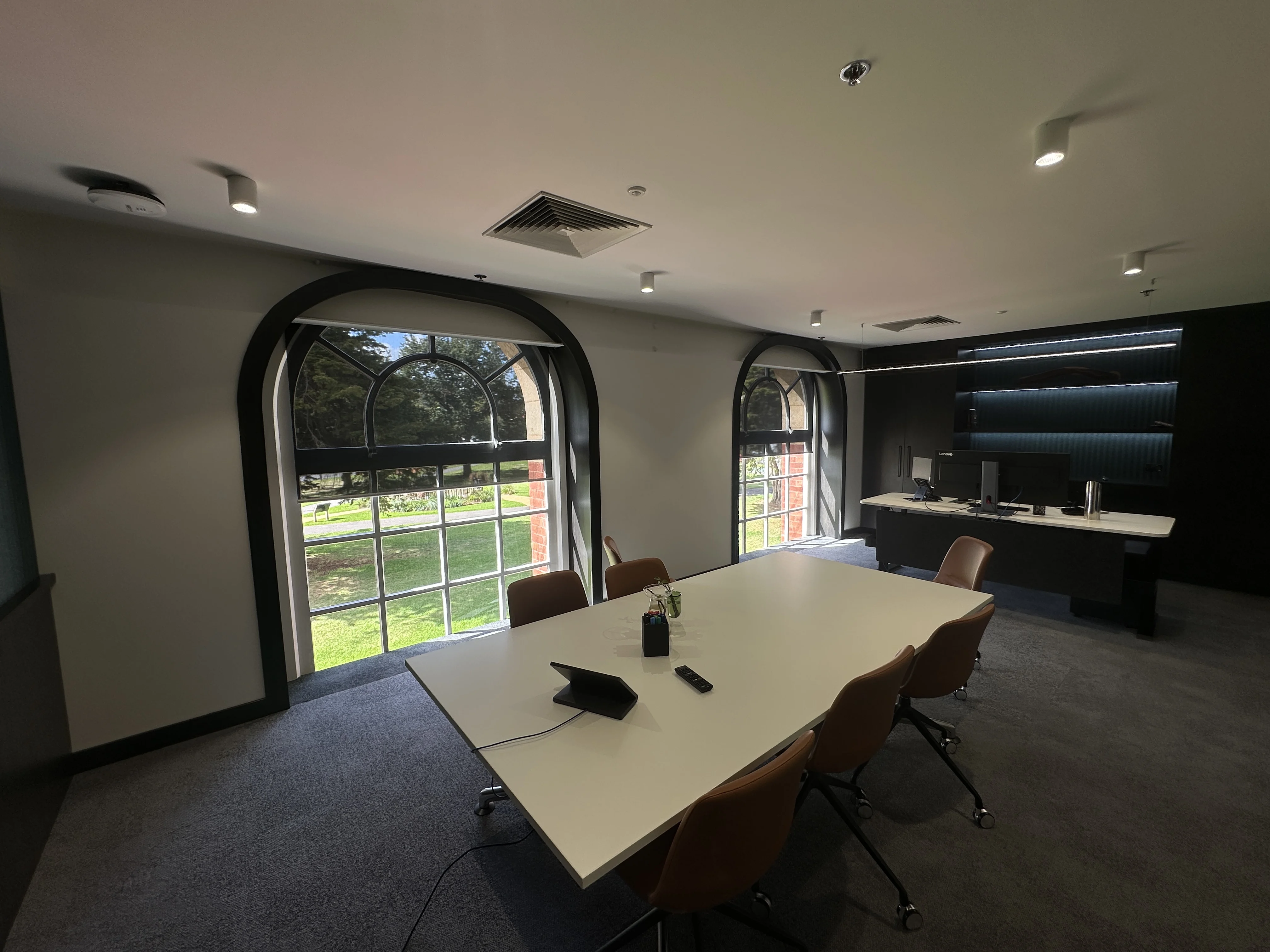 Executive office with motorised day and night roller blinds for light control and privacy