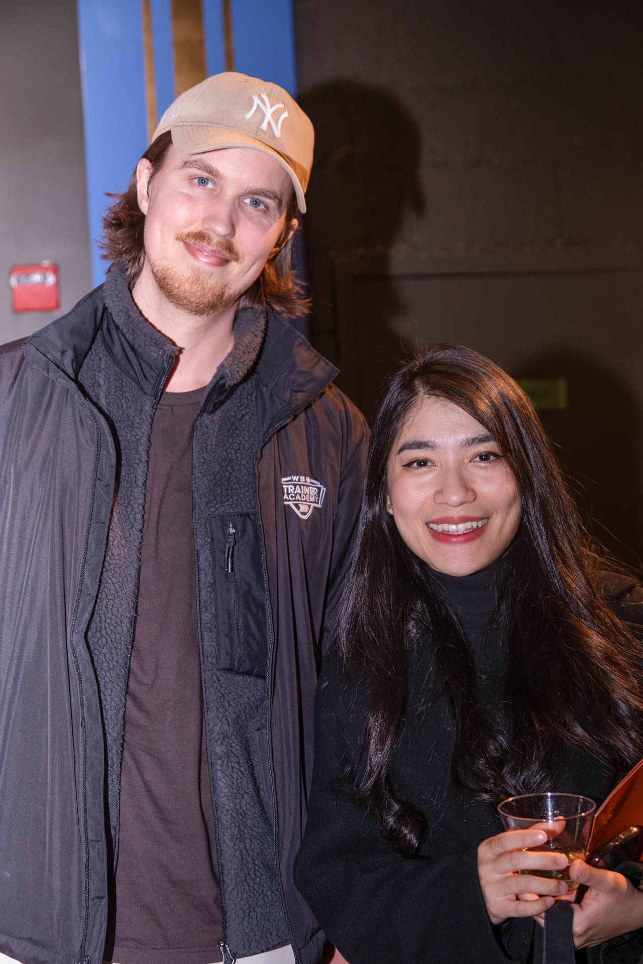 a group of students smiling for the camera in the SVA Theatre lobby after the Venture Forum