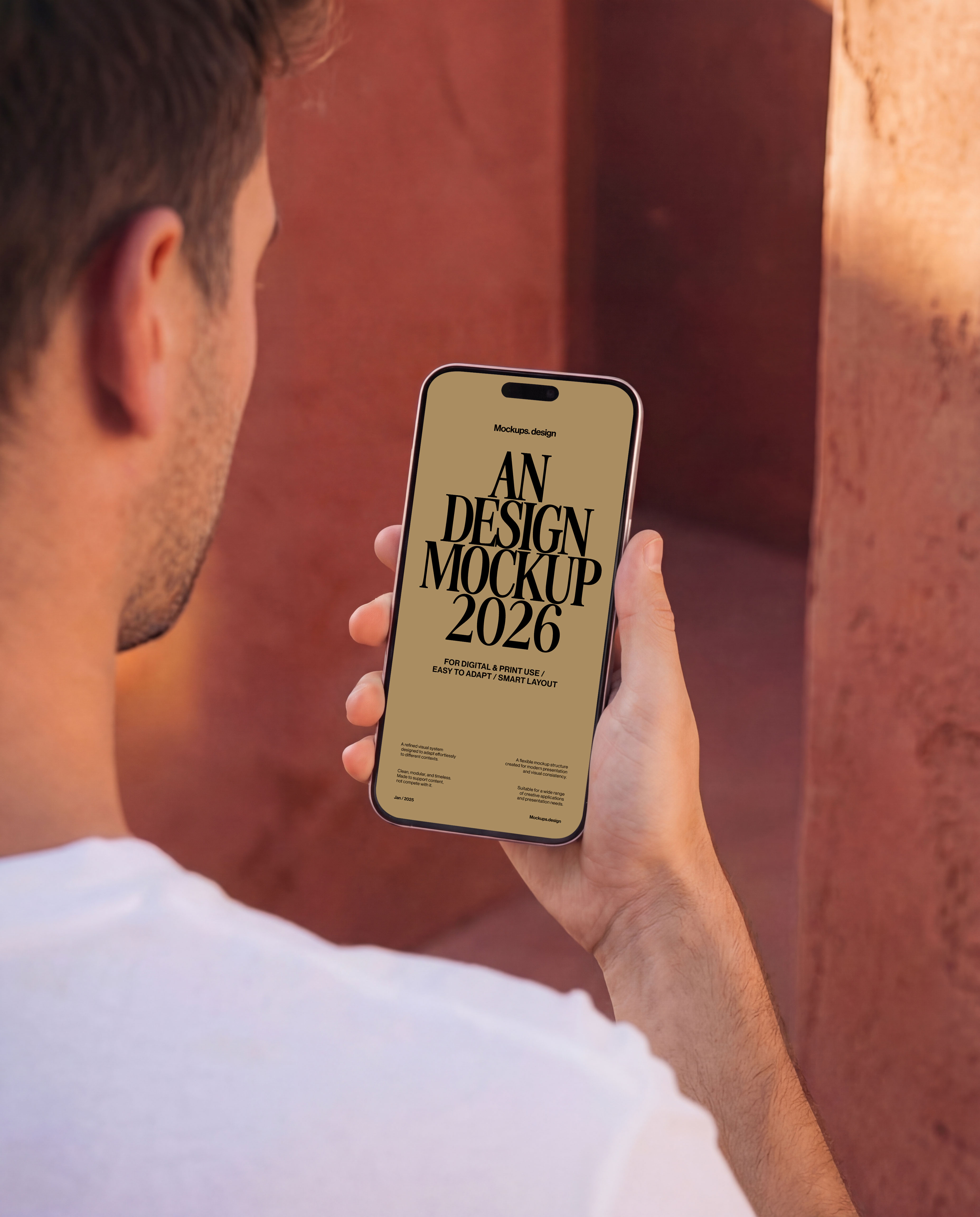 Man holding iPhone 16 mockup, realistic outdoor scene