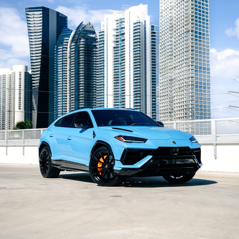 Epic blue Lamborghini Urus S rental Miami, front 3/4 view, luxury performance SUV hire.