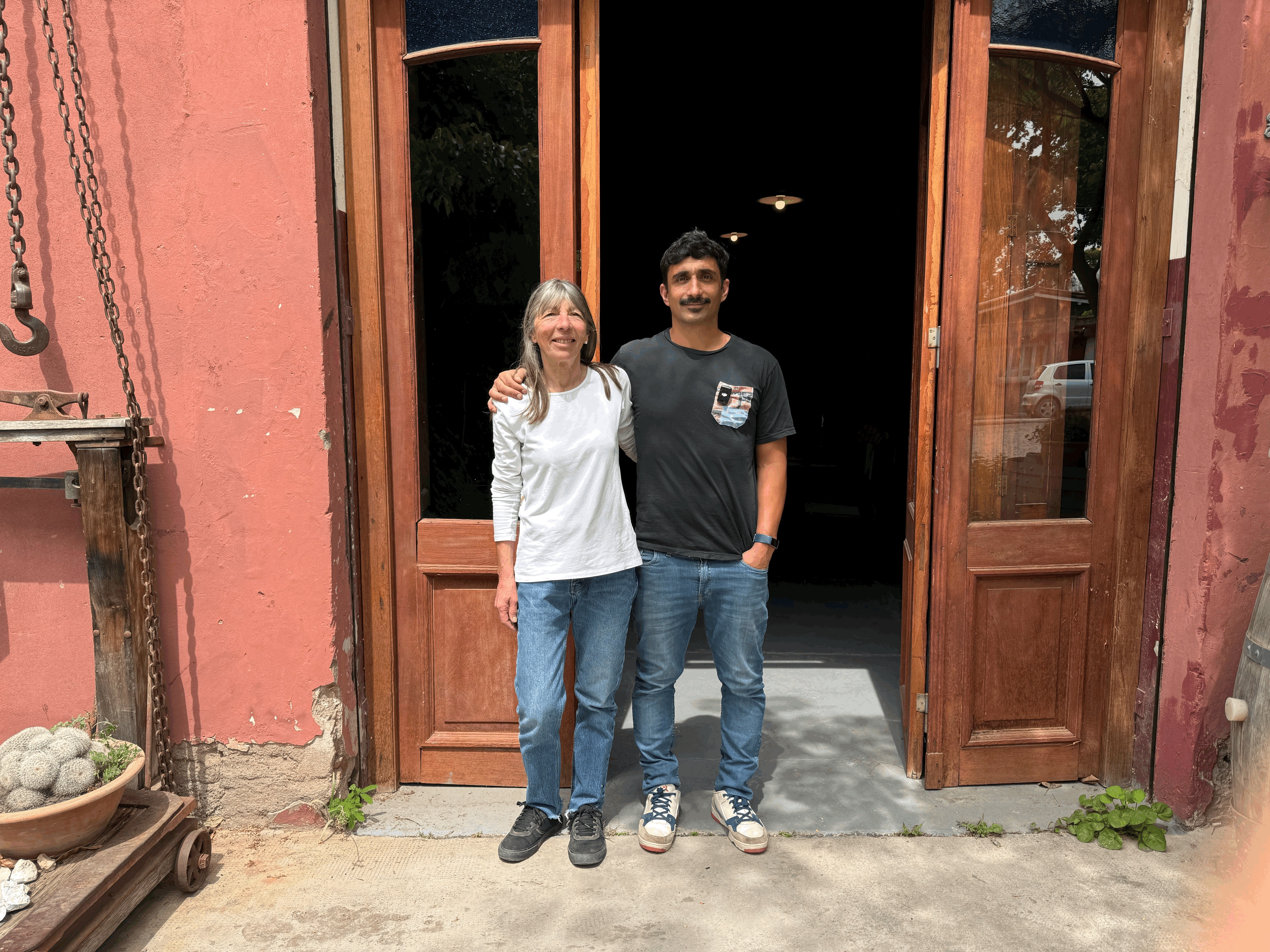 Pulmary winemaker Ramiro Maures and his mother standing together outside Bodega Pulmary in Mendoza