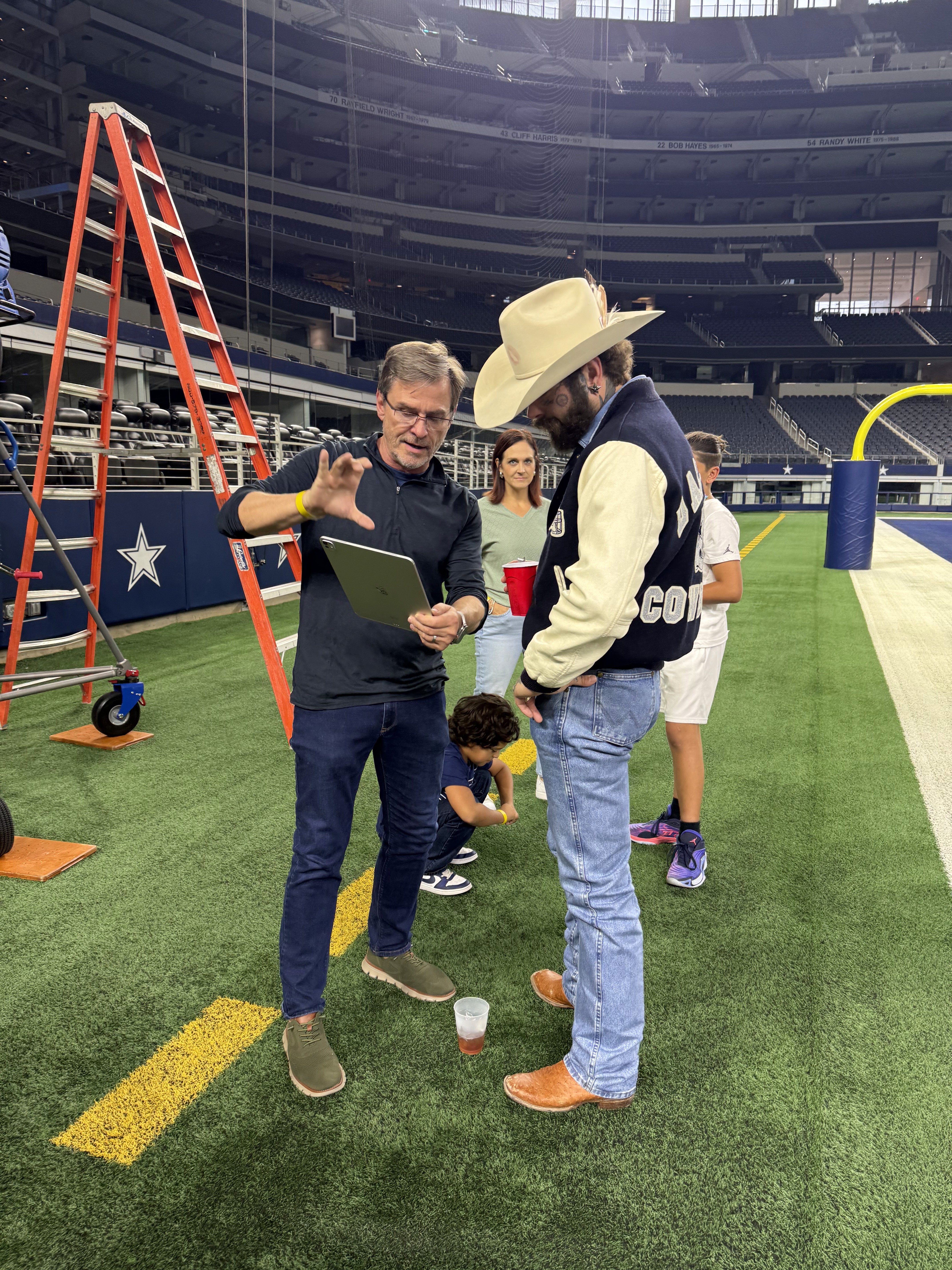 Senior Creative Director Stephen Dahlem workign with Post Malone at Dallas Cowboys Halftime Show