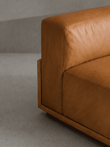 Close up of a Minimalist leather lounge in soft lighting